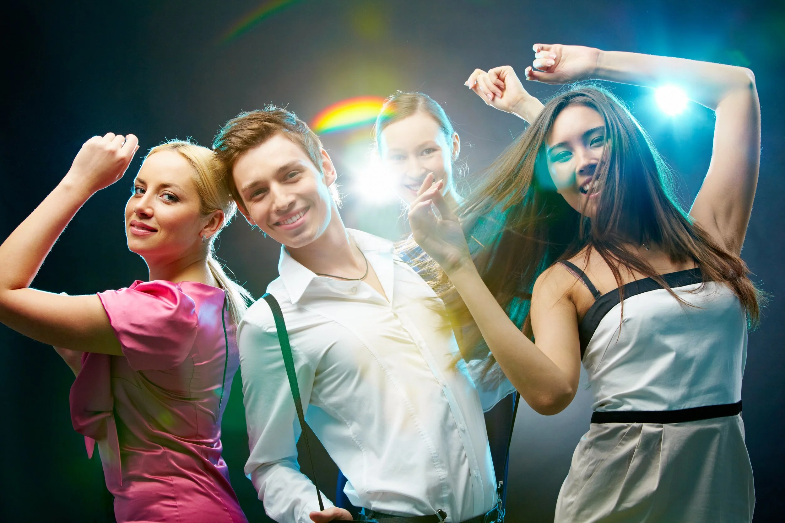 a-group-of-four-friends-dancing-and-looking-at-camera-SBI-305537897.jpg