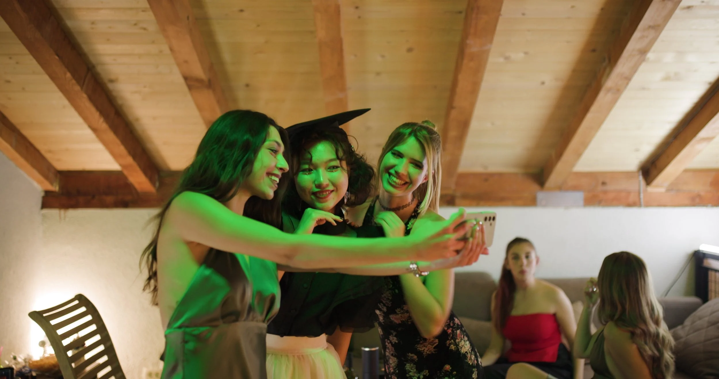 happy-graduates-taking-selfies-at-a-graduation-party-celebrating-friendship-achievemen-SBI-357361409.jpg