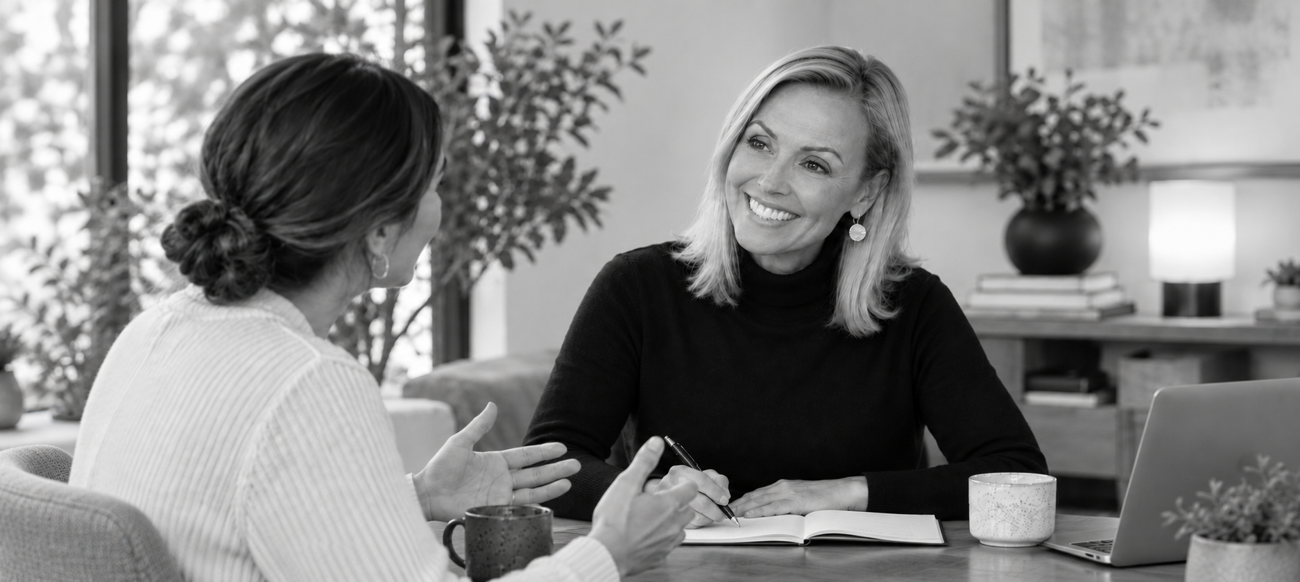 Debrah Kemp in conversation at a table.