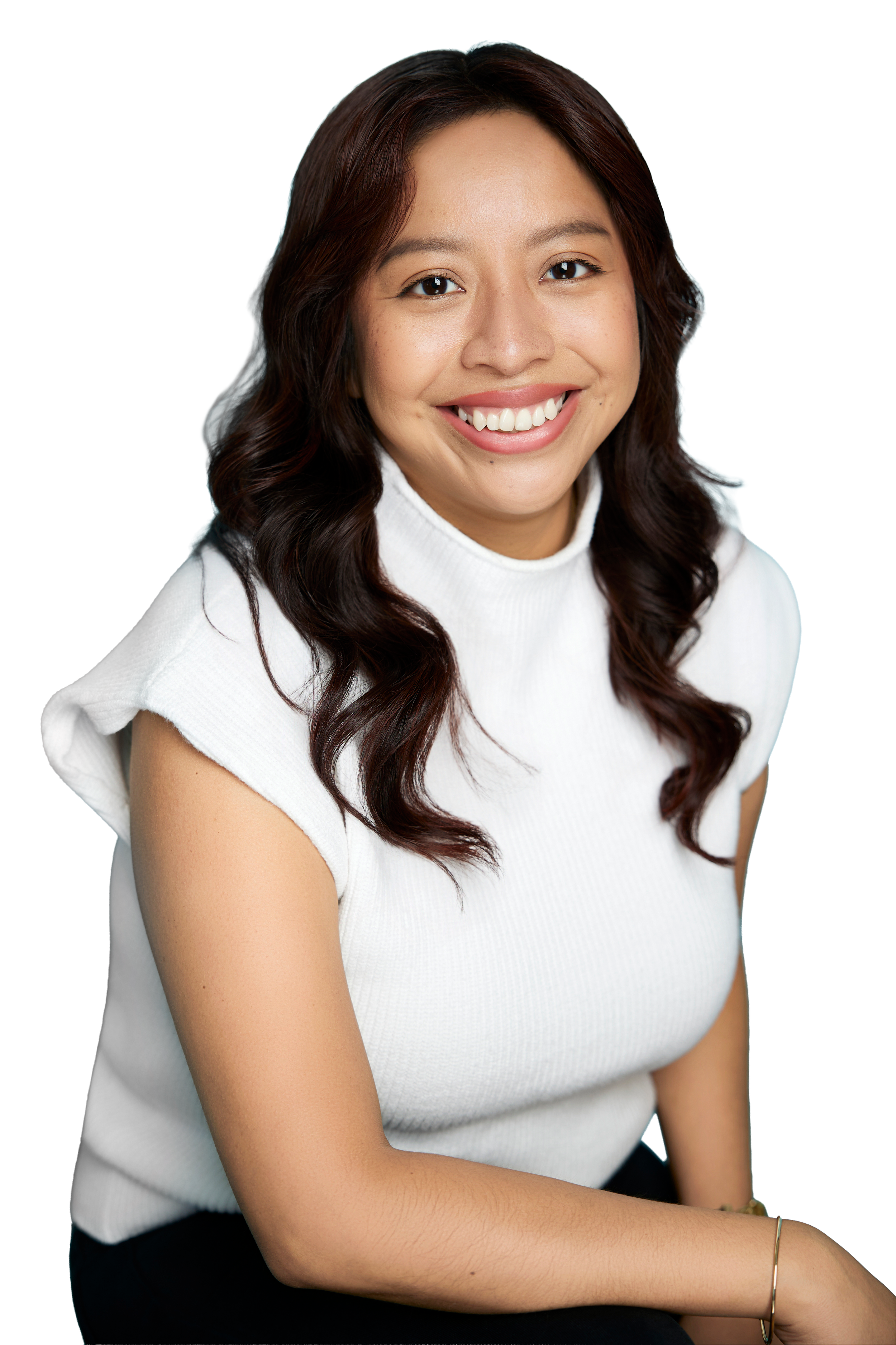 Smiling woman with long dark hair wearing a white shirt