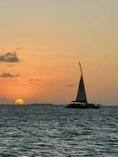 Sailboat on water during sunset with a mostly clear sky in St. Lucia.