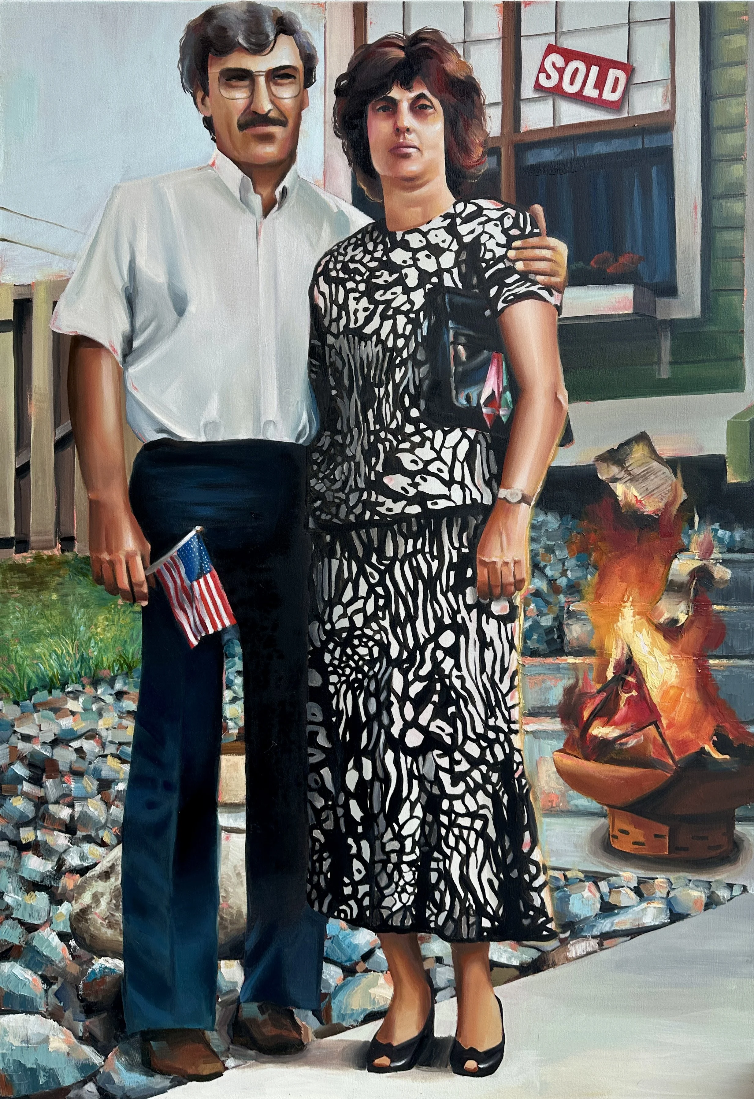 A man and woman standing in front of a house with a 'sold' sign in the window, holding small American flags, with a campfire nearby.
