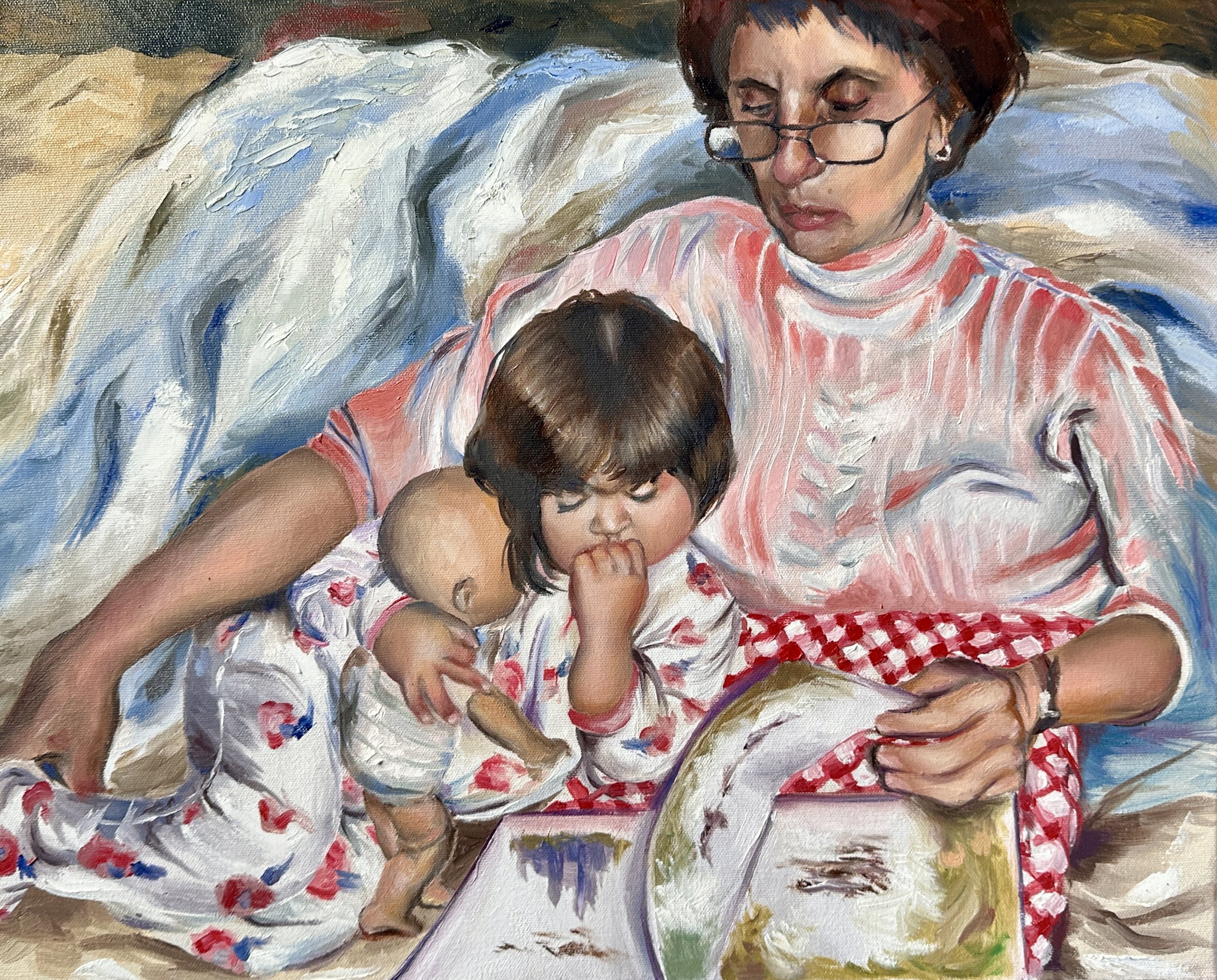 A woman with short brown hair and glasses holding a young girl with dark hair, both sitting on a bed with a colorful quilt. The woman is looking down at the girl, who is touching her own face, and the scene appears warm and tender.