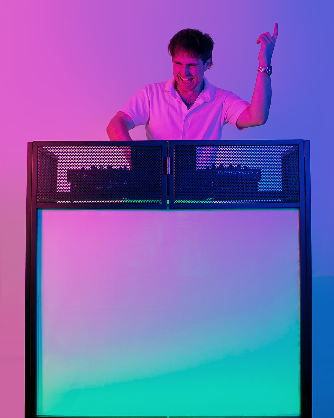 DJ Sona with a colorful lighted setup with pink, purple, and blue lighting.