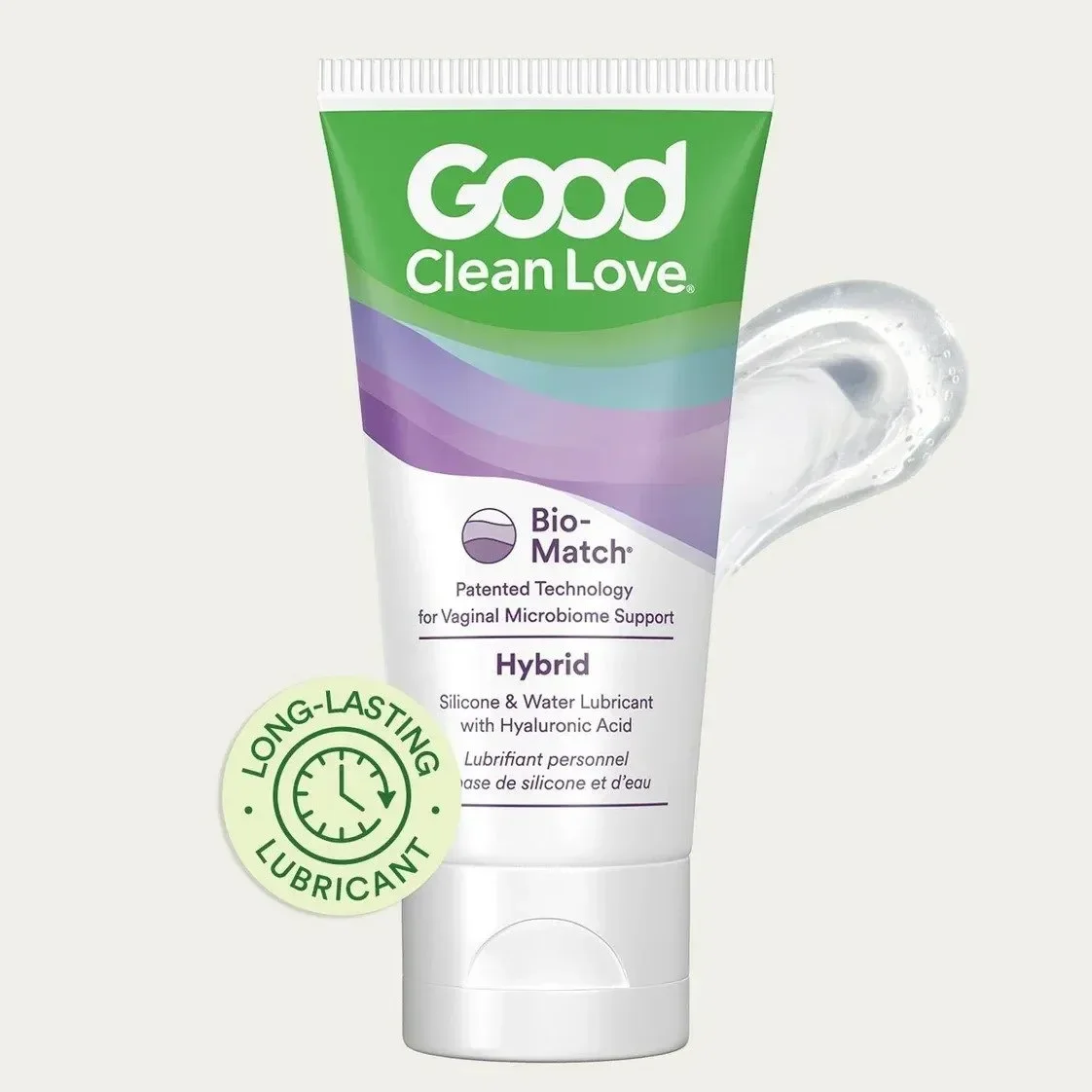 Tube of Good Clean Love Bio-Match Hybrid lubricant with hyaluronic acid, featuring a splash of transparent gel next to it and a green circular icon indicating long-lasting lubricant.