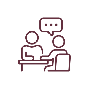 Outline of two people sitting at a table and having a conversation.
