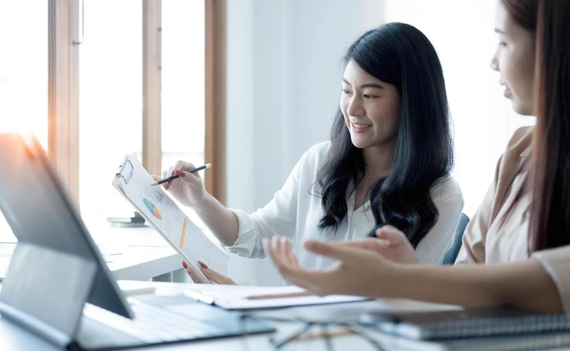 two-young-asian-businesswoman-discuss-investment-project-working-and-planning-strategy-business-people-talking-together-with-laptop-computer-at-office-free-photo (1).jpg