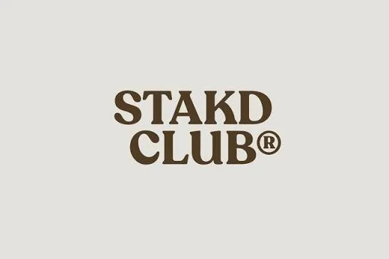 Logo with the text 'STAKD CLUB®' in bold brown letters on a light background.