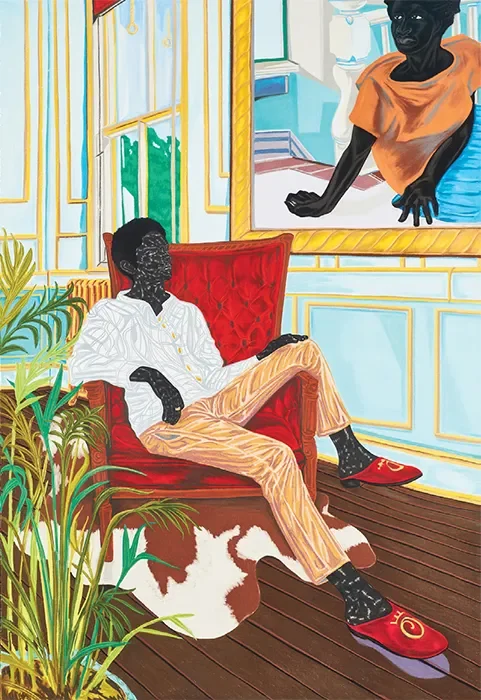 A black person sitting in a red armchair, wearing a white shirt, tan pants, and red slippers, in a room with wooden floors, houseplants, and a large framed painting of a woman with dark skin and short hair hanging on the wall.