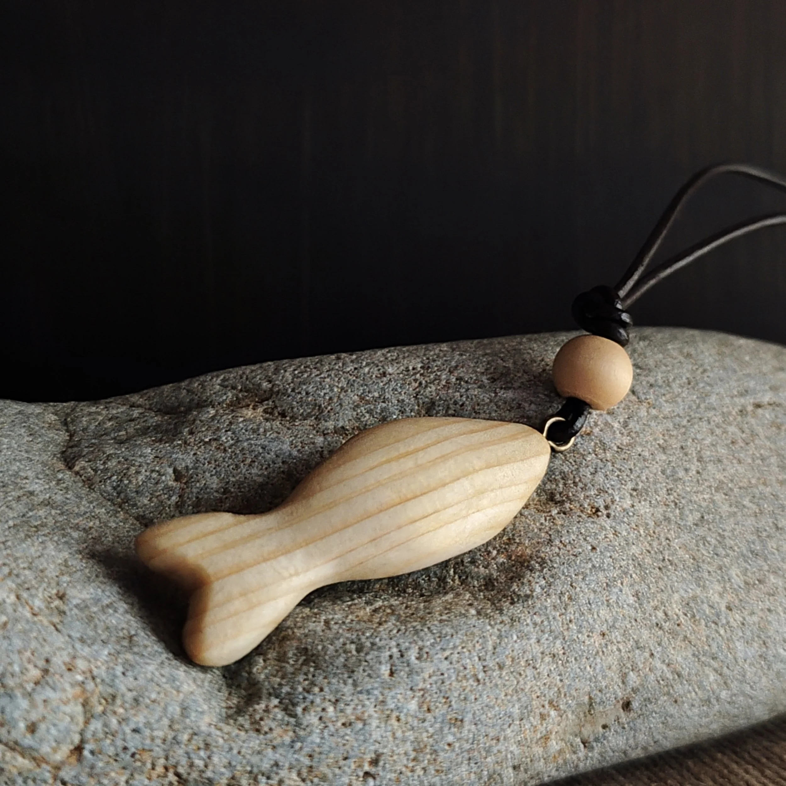 The Keeper of the Flow – hand‑carved pine fish pendant