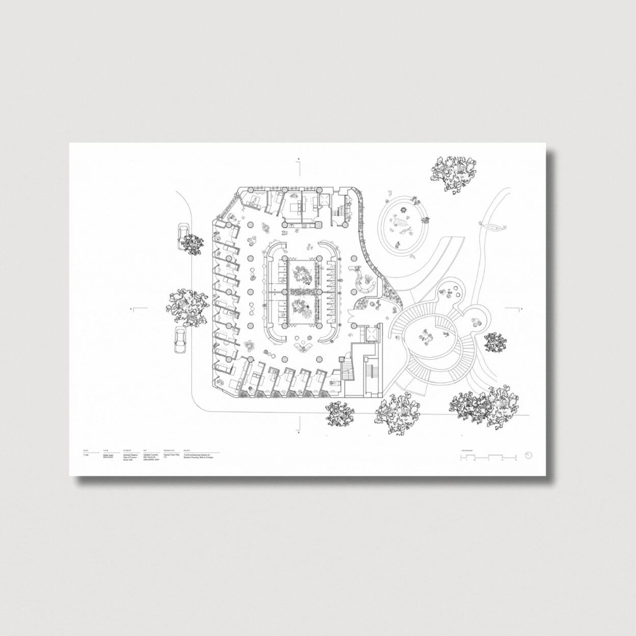 Architectural blueprint of a building with surrounding landscaped outdoor area featuring trees, pathways, and outdoor seating.