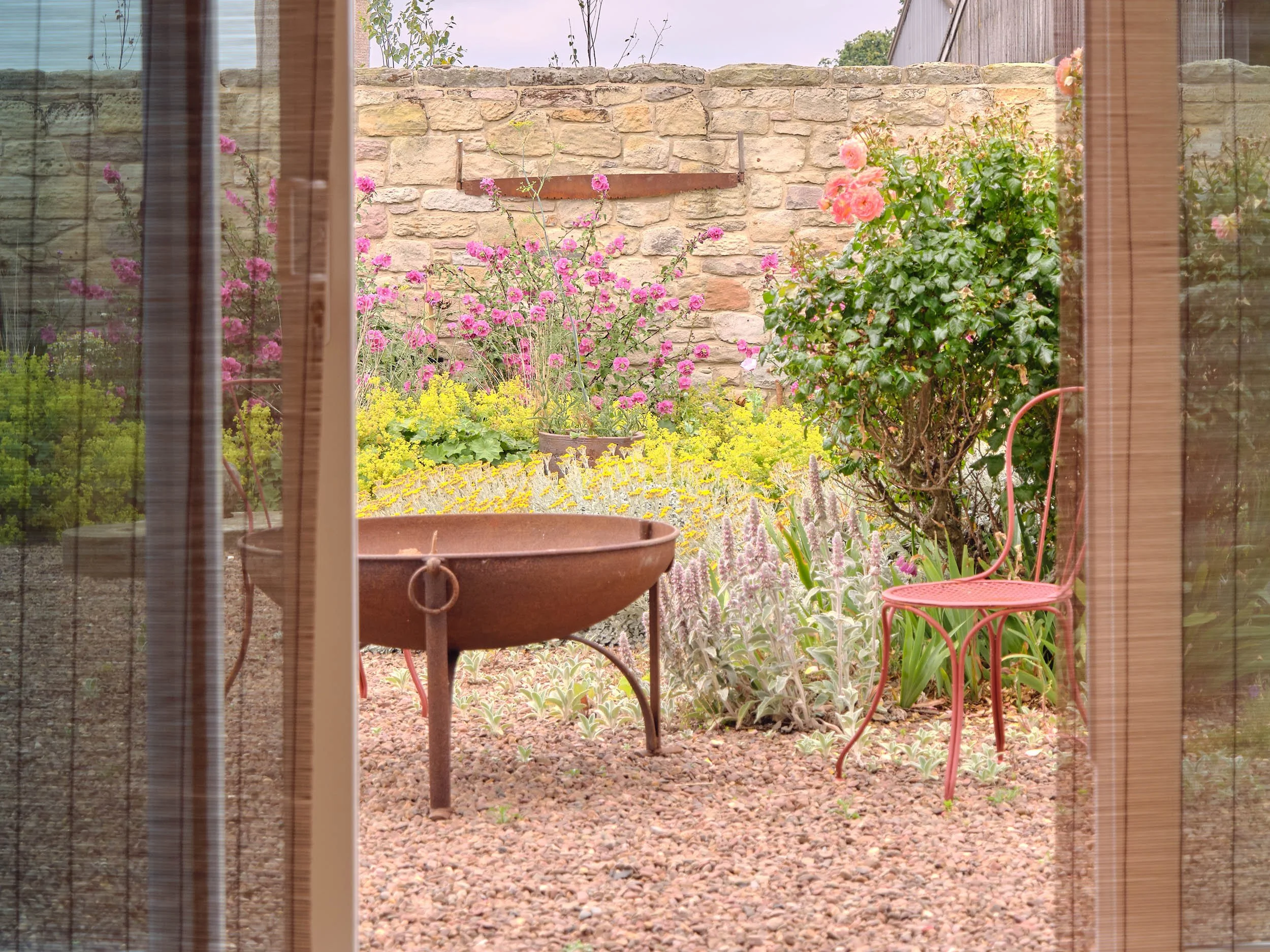 SUNROOM DOORS ONTO GARDEN