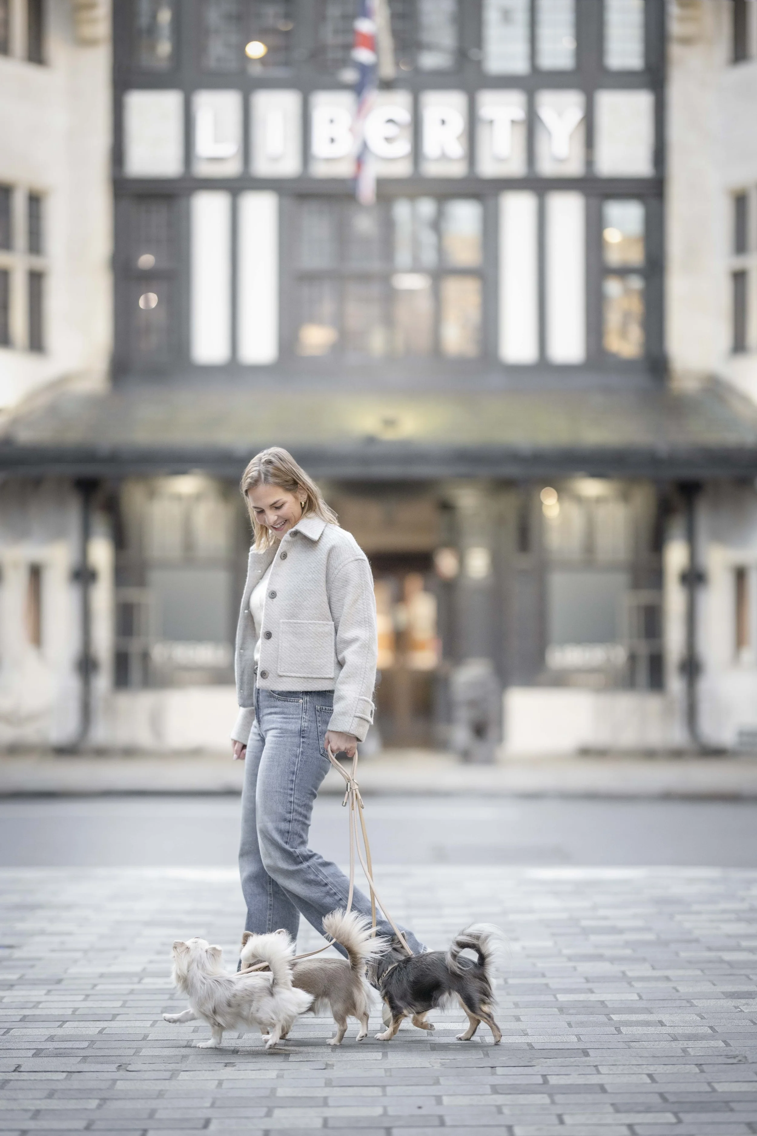 Lilo Ask-Henriksen walking her dogs past Liberty in central London