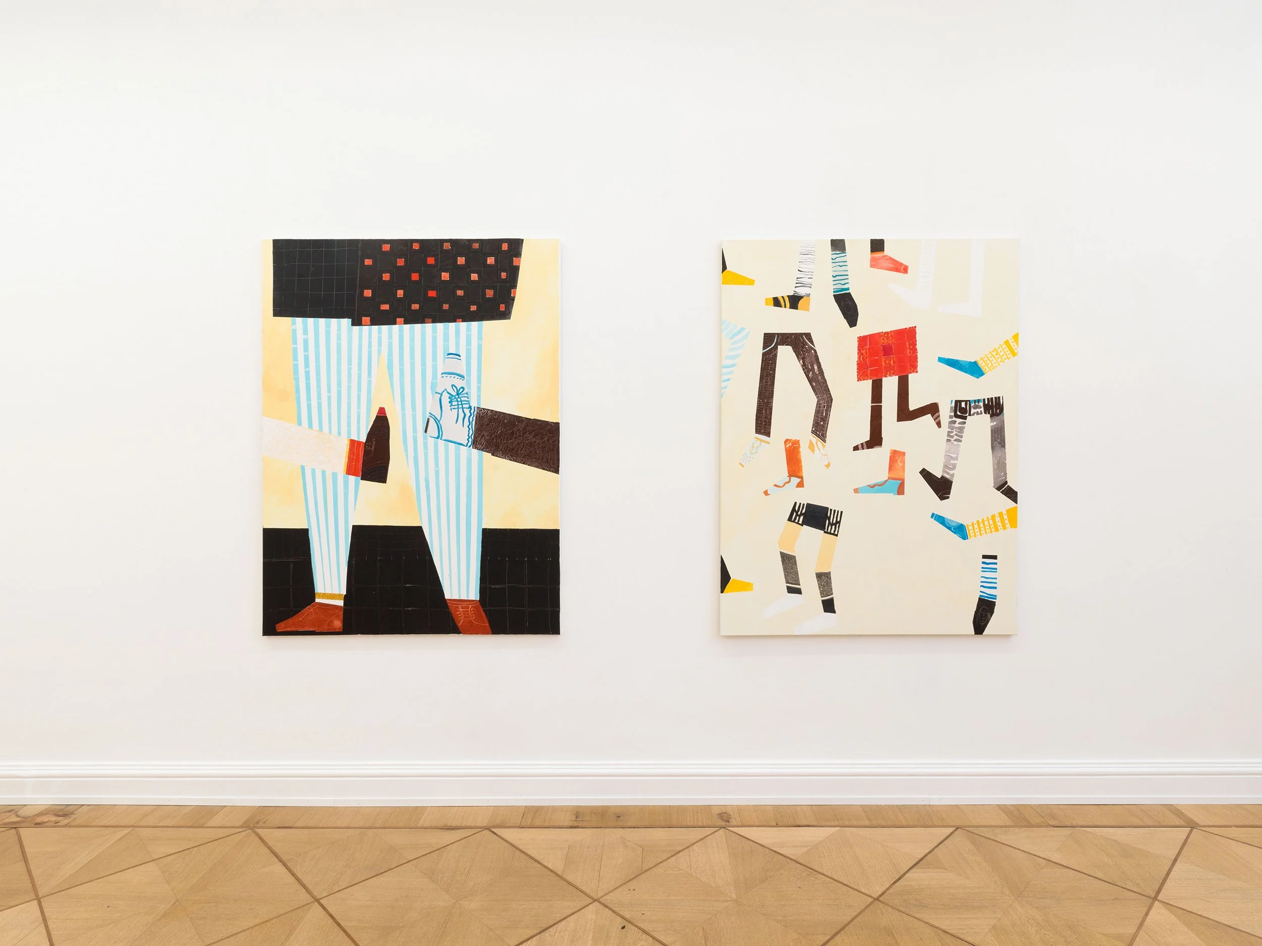Two colorful art posters displayed on a white gallery wall, featuring abstract illustrations of people with patterned clothing and shoes, in a museum or gallery setting.