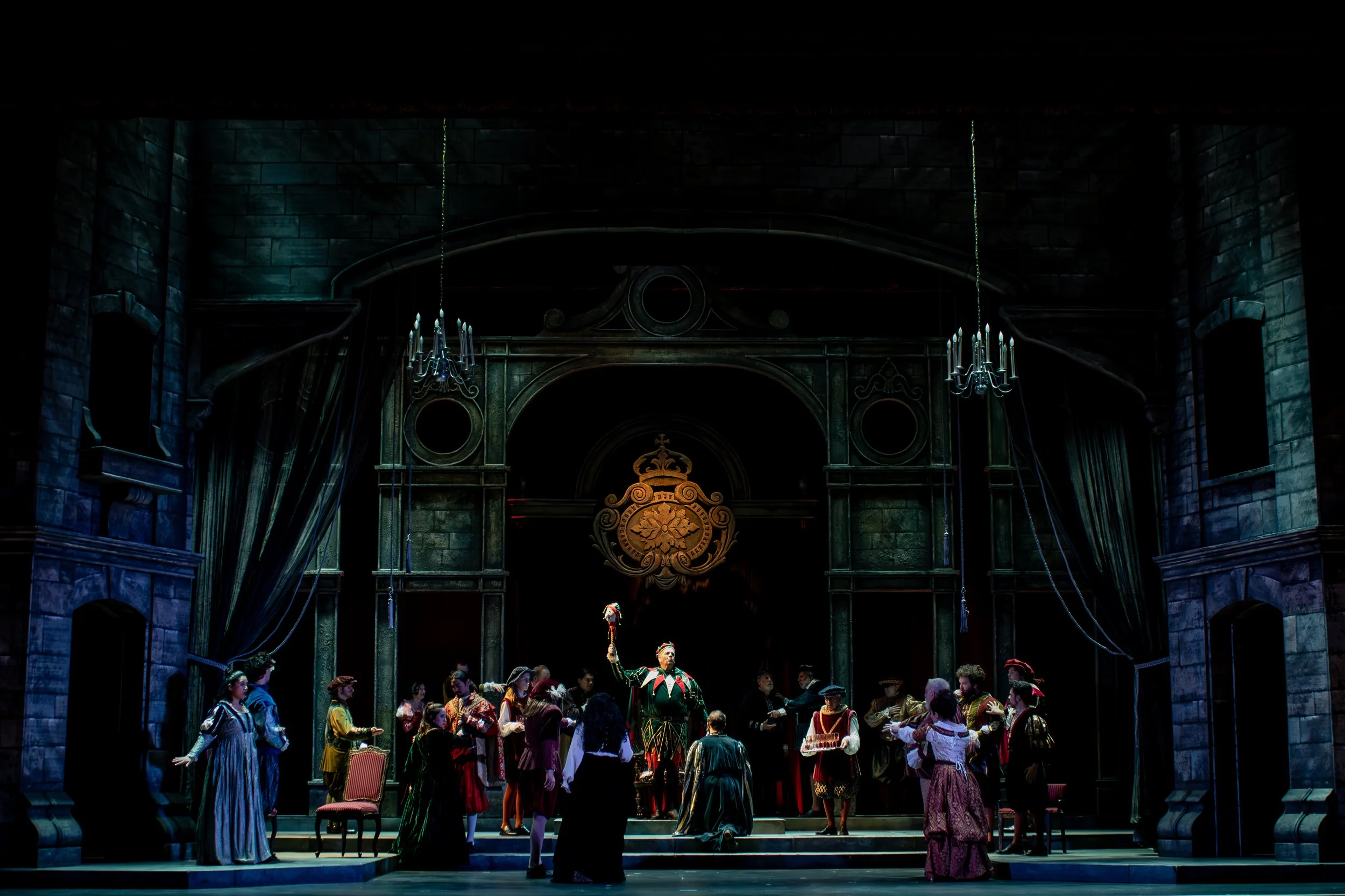 Rigoletto Production Photo: A frozen moment illuminating Rigoletto in the middle