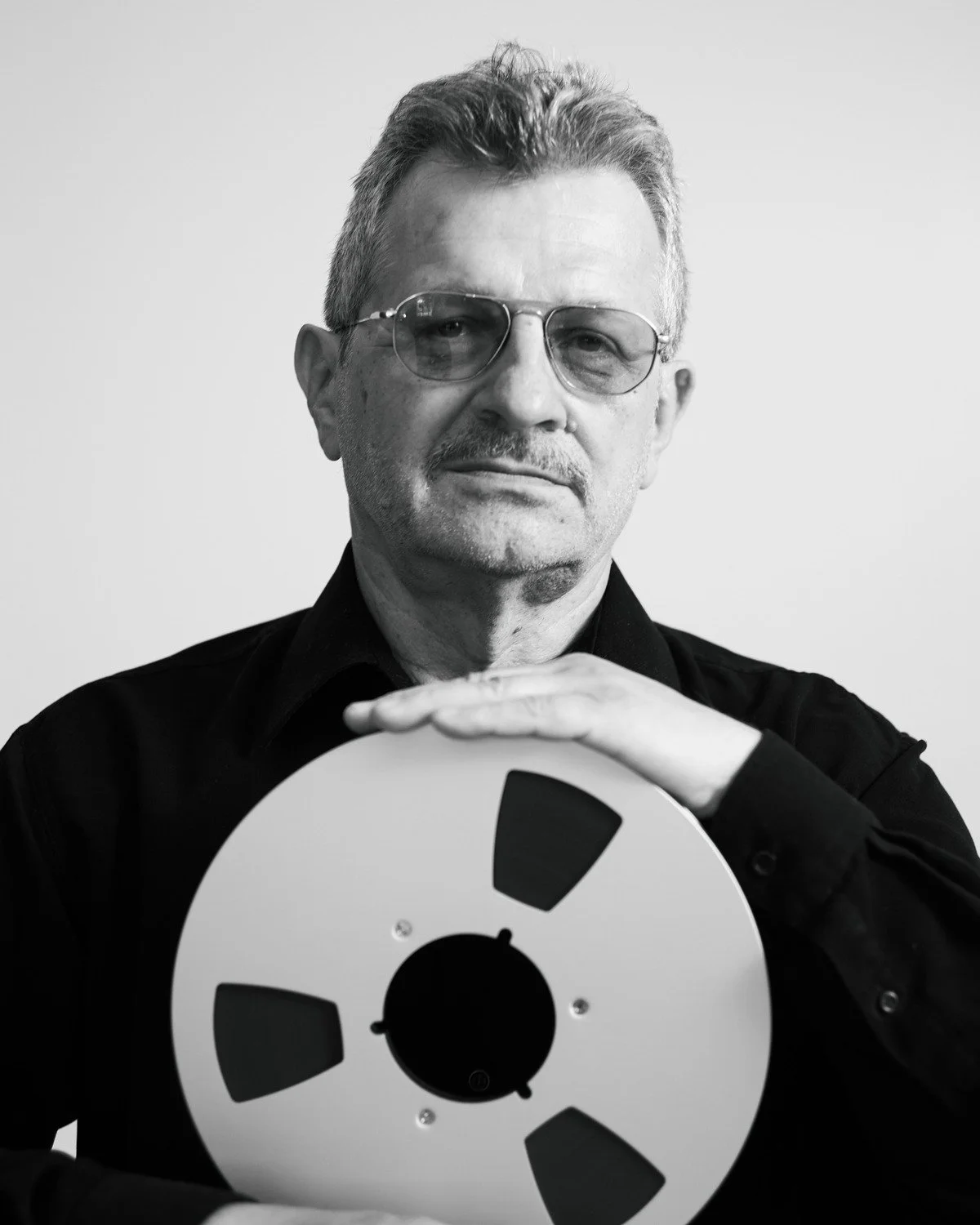 Stefan Elefteriu holding a tape reel, 2026