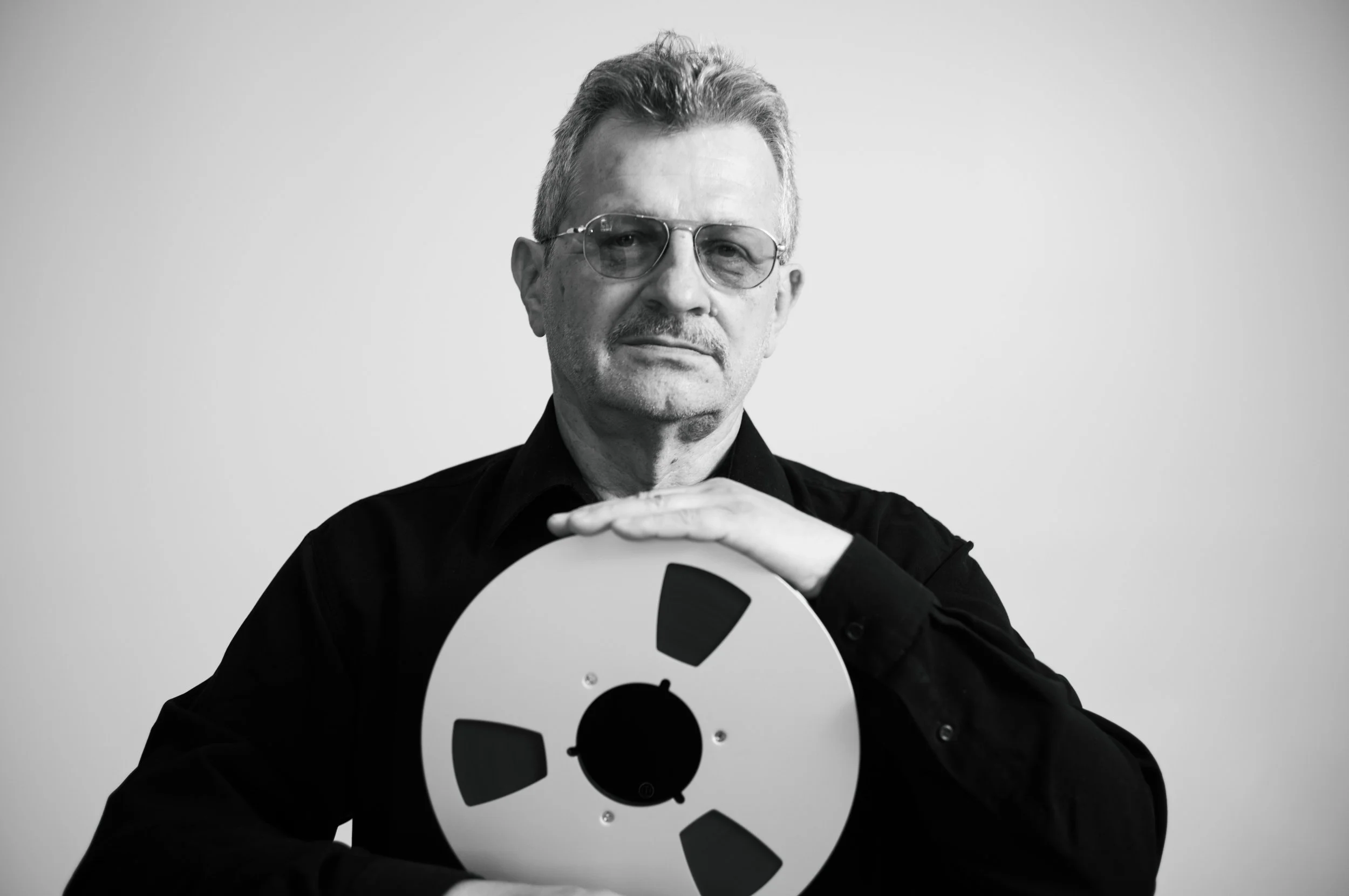 Stefan Elefteriu holding a tape reel, 2026 Caption	none Link	none