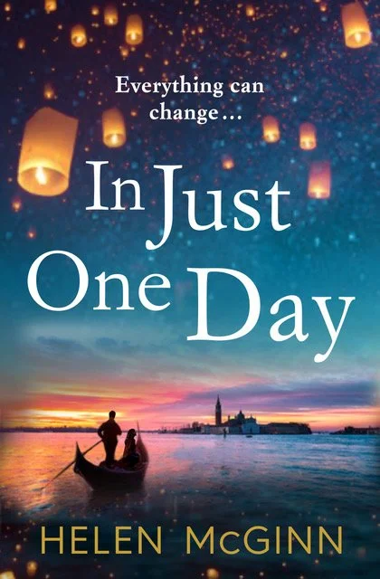 Book cover titled 'In Just One Day' by Helen McGinn, featuring a sunset over water with a silhouette of a couple in a boat, and floating sky lanterns in a dark, starry sky.