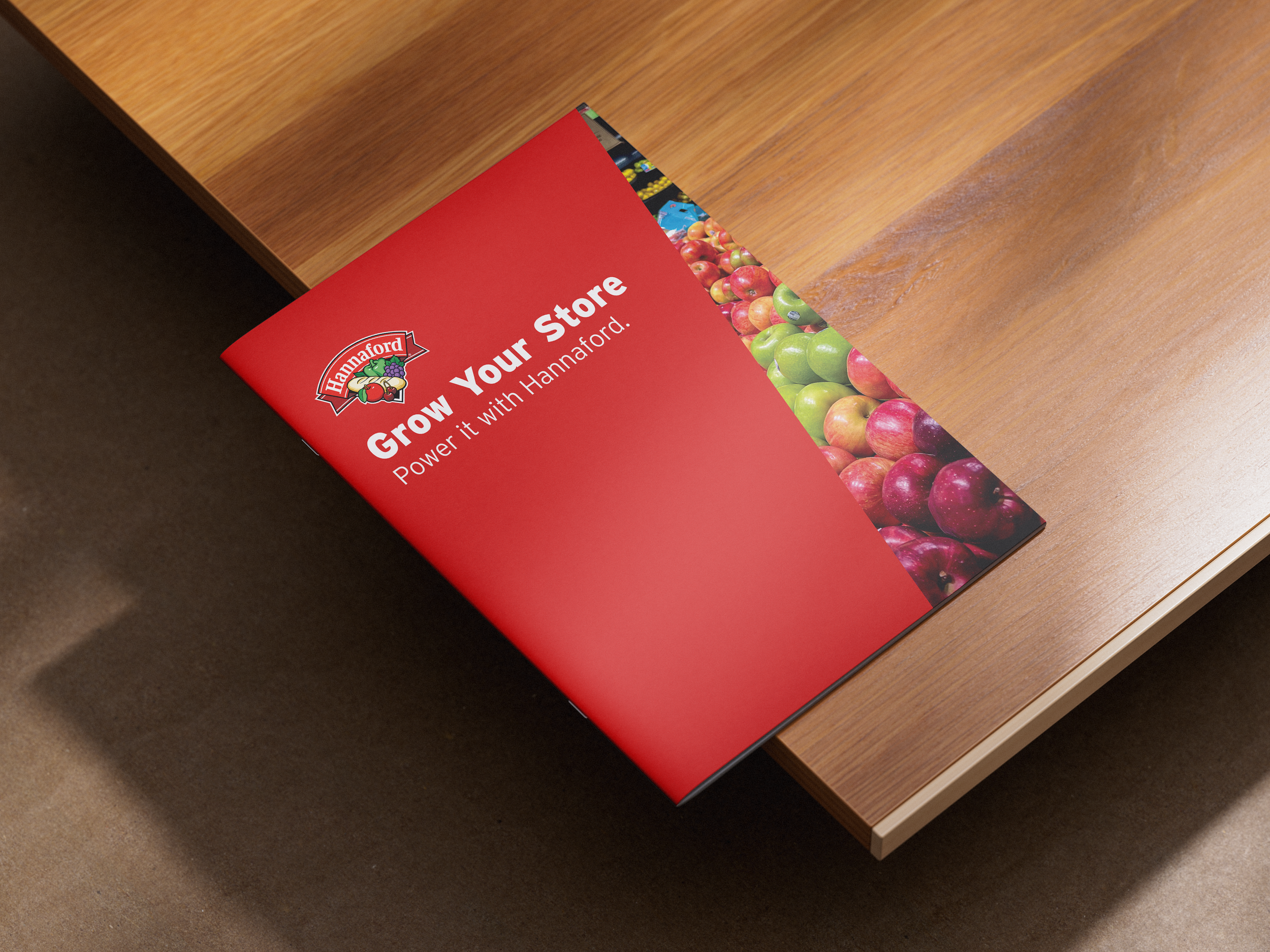 Brochure titled 'Grow Your Store, Power it with Hannaford' on a wooden surface.
