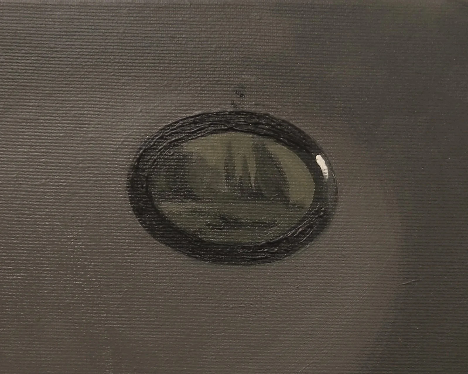 Close-up of a ceiling with a circular smoke detector or sensor mounted on textured ceiling surface.