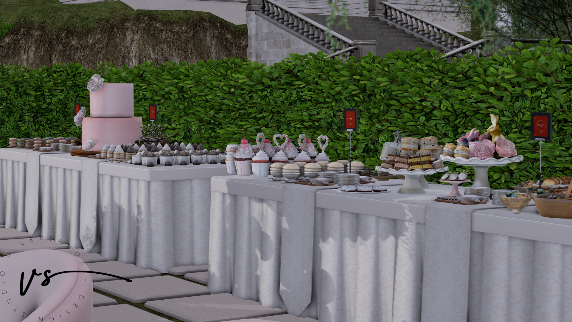 Dessert table at an outdoor event with various sweet treats including cupcakes, macarons, cookies, and cake, decorated with pink and pastel colors, set against green foliage and stone staircase.