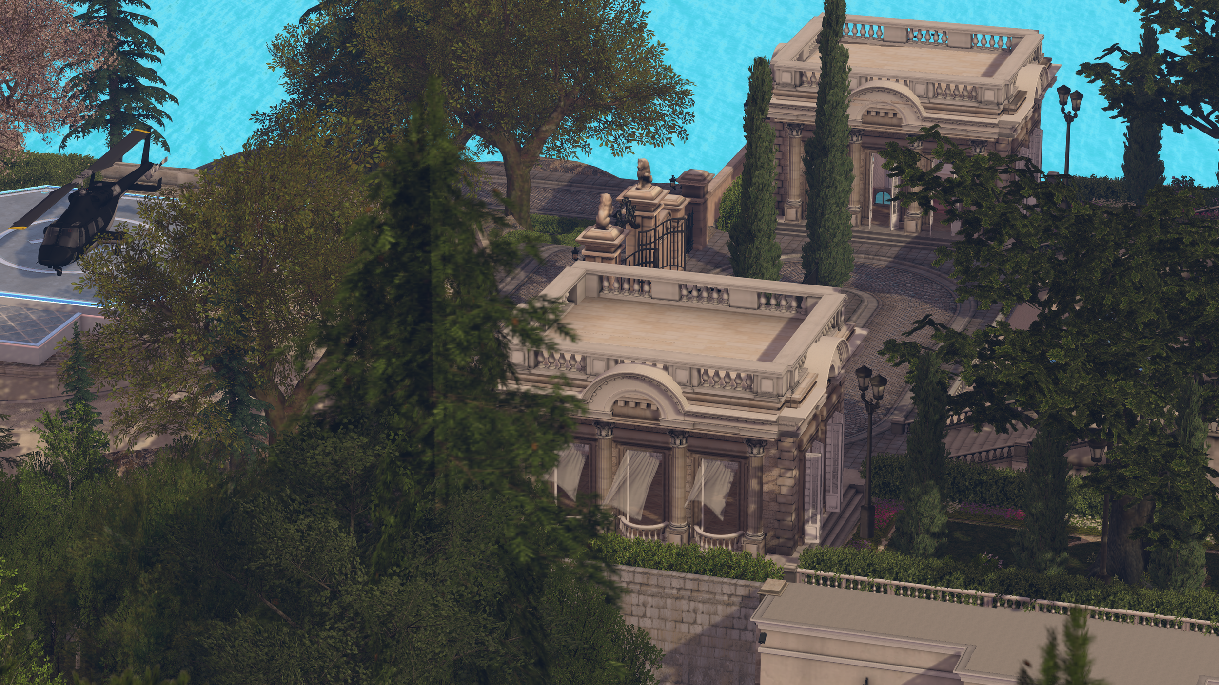 A helicopter parked on a helipad near a luxurious building with classical architecture, surrounded by trees and a swimming pool.