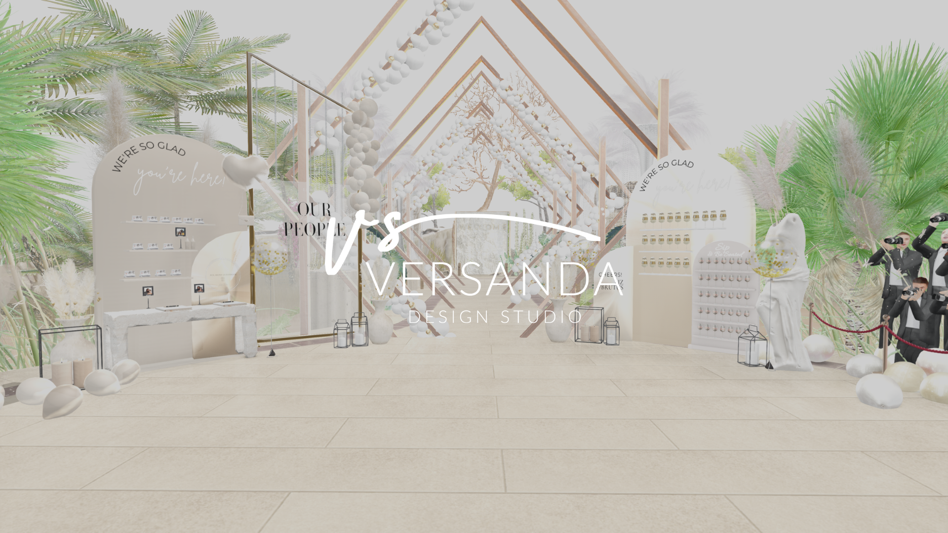 A virtual wedding or event reception decorated with white and pastel colors, featuring arches, balloons, and greenery, with tables and display stands, and the words 'It's VERSAND' in the center.