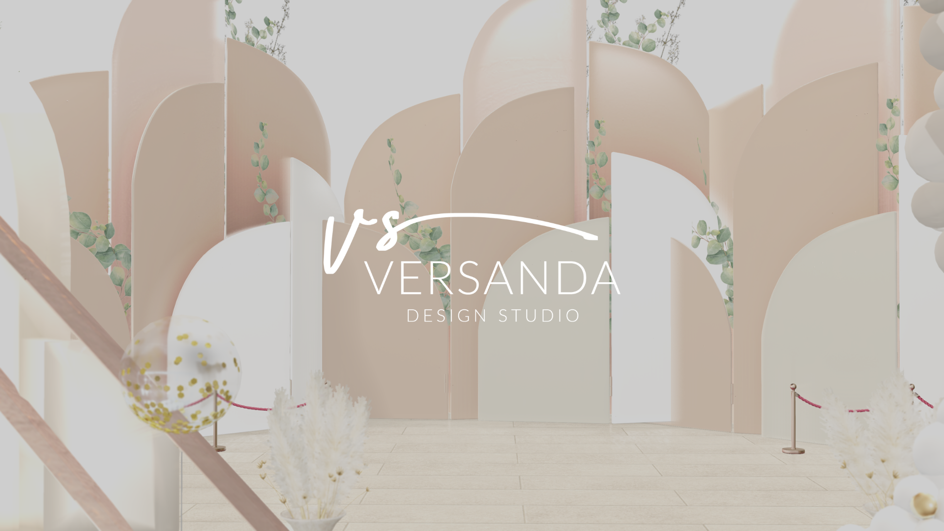 A design studio interior with pastel pink and cream-colored curved partitions, greenery accents, and a transparent balloon with gold confetti. The logo "VS Versanda Design Studio" is centered on the image.