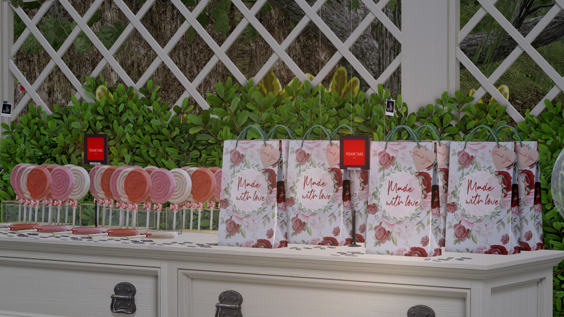 Display of pink and white swirl lollipops, gift bags with floral designs and the words 'Made with love,' and small red signs that say 'Please take one,' on a white outdoor table with a green leafy background and a white lattice fence.