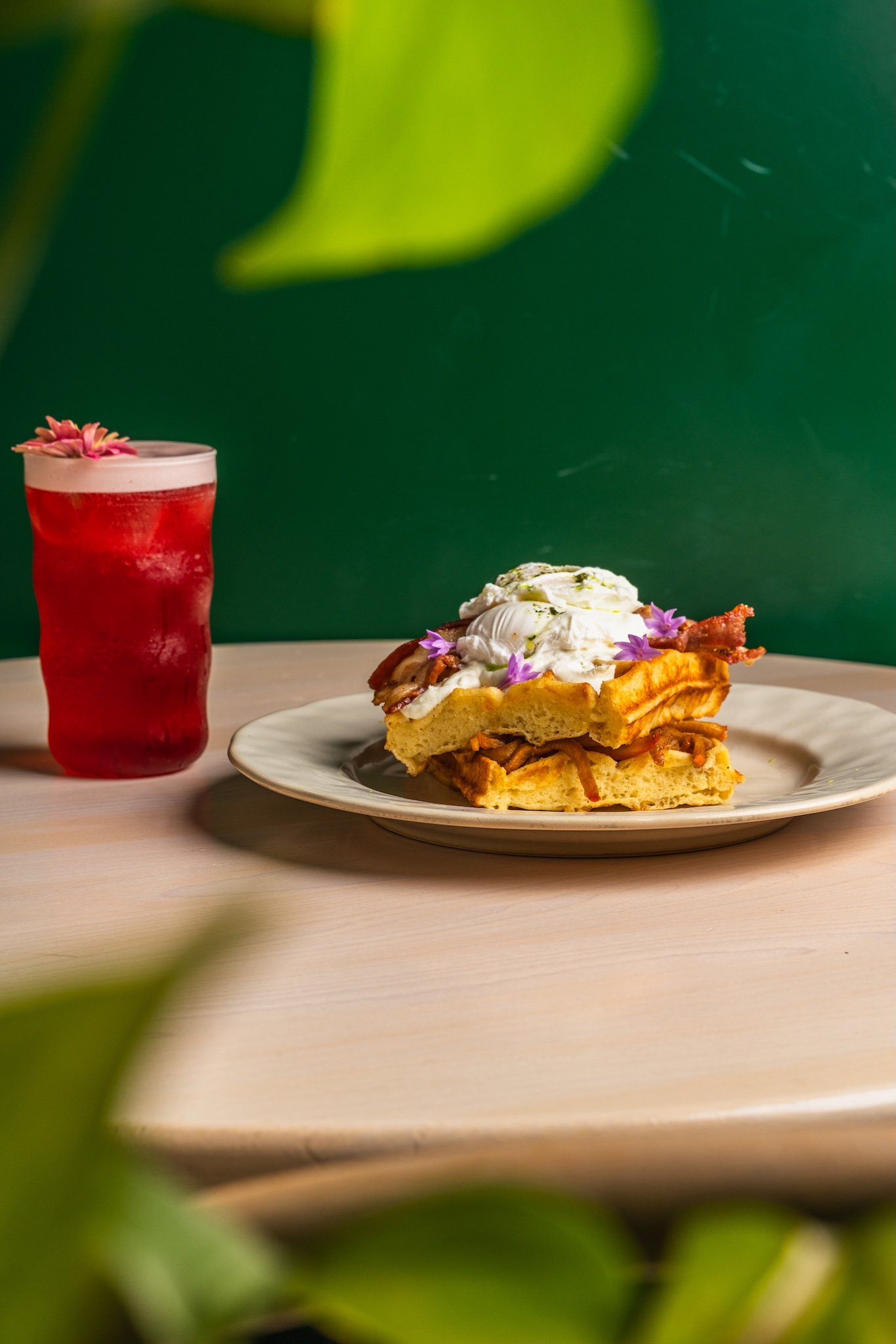 Red iced drink and French toast on a terrace table, café photography Malta