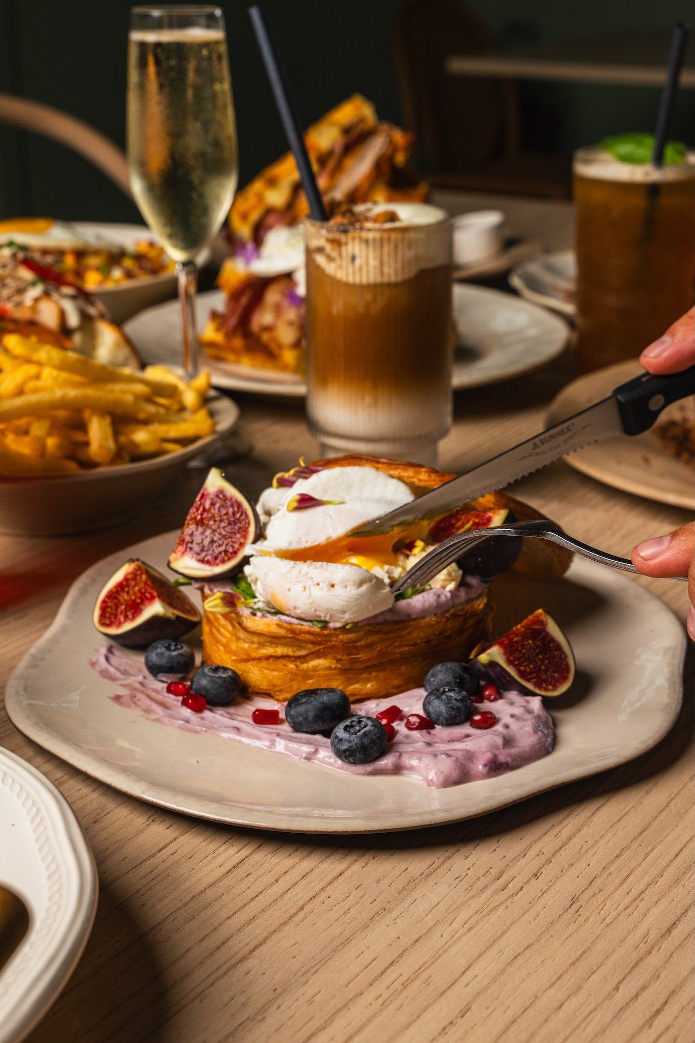 Brunch table with French toast and iced coffees, restaurant photography Malta