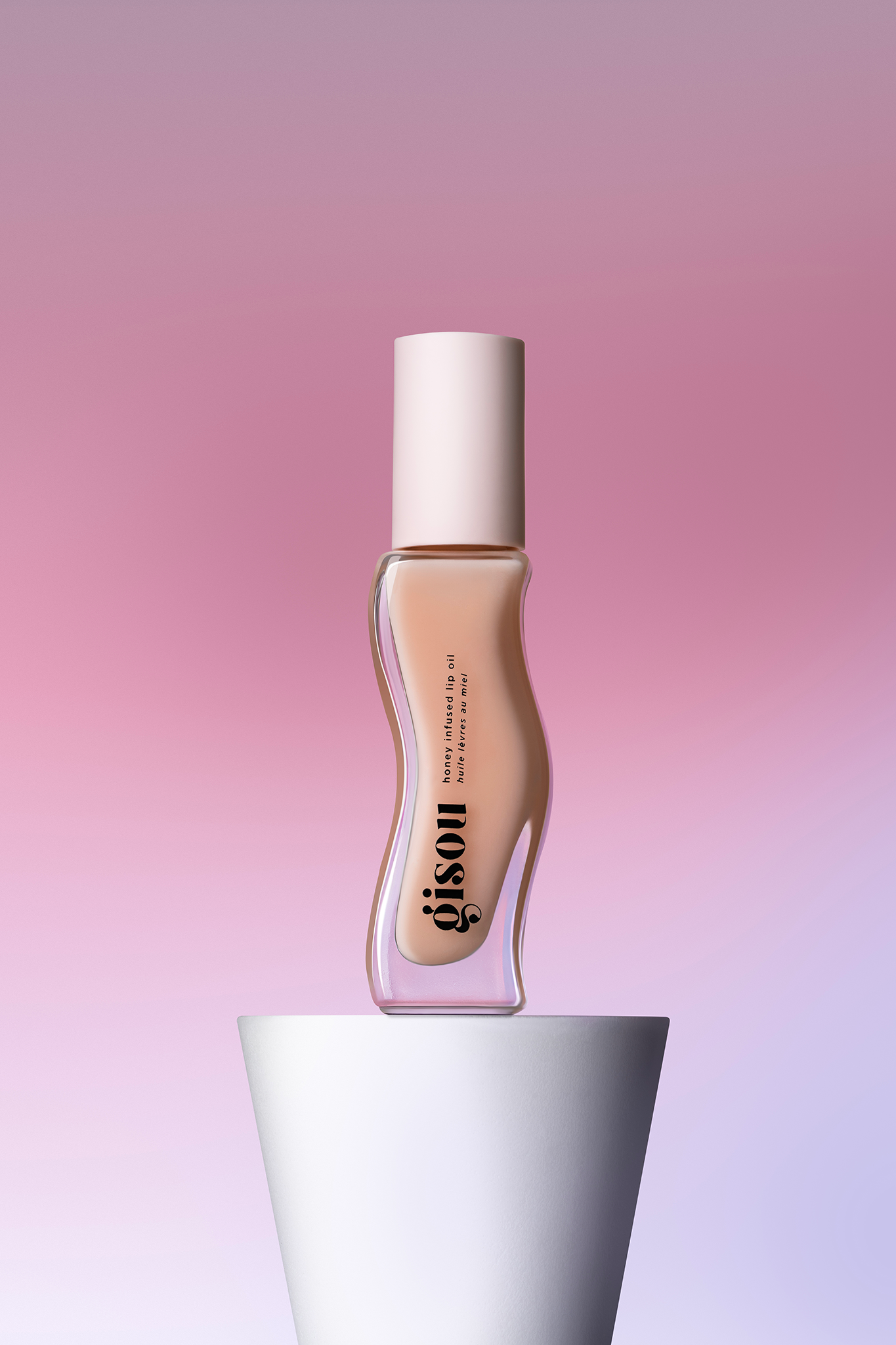 Lip oil bottle on a white plinth against a pink and purple backdrop, cosmetics product photography