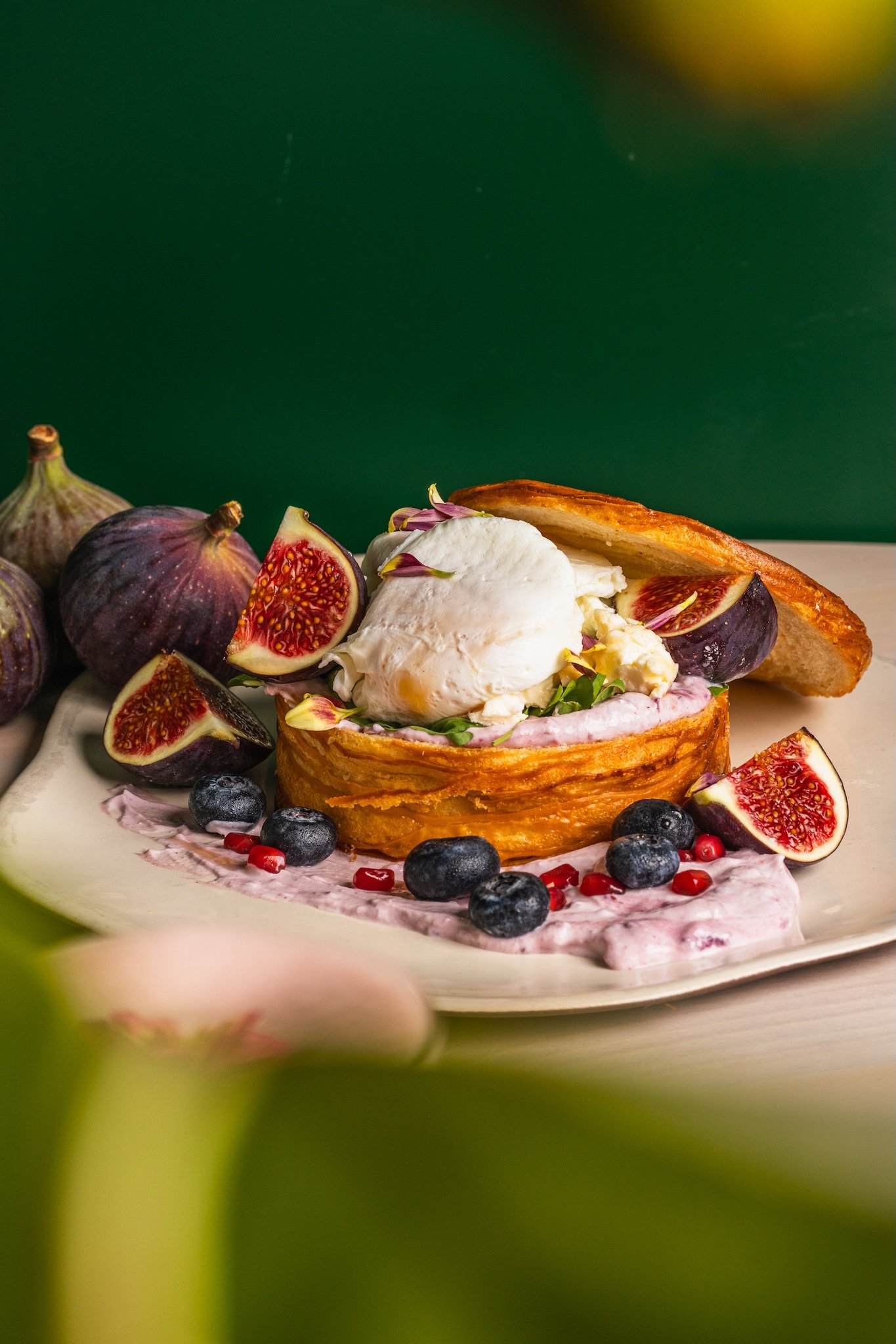 Close-up of French toast with fresh figs and berries, restaurant food photography