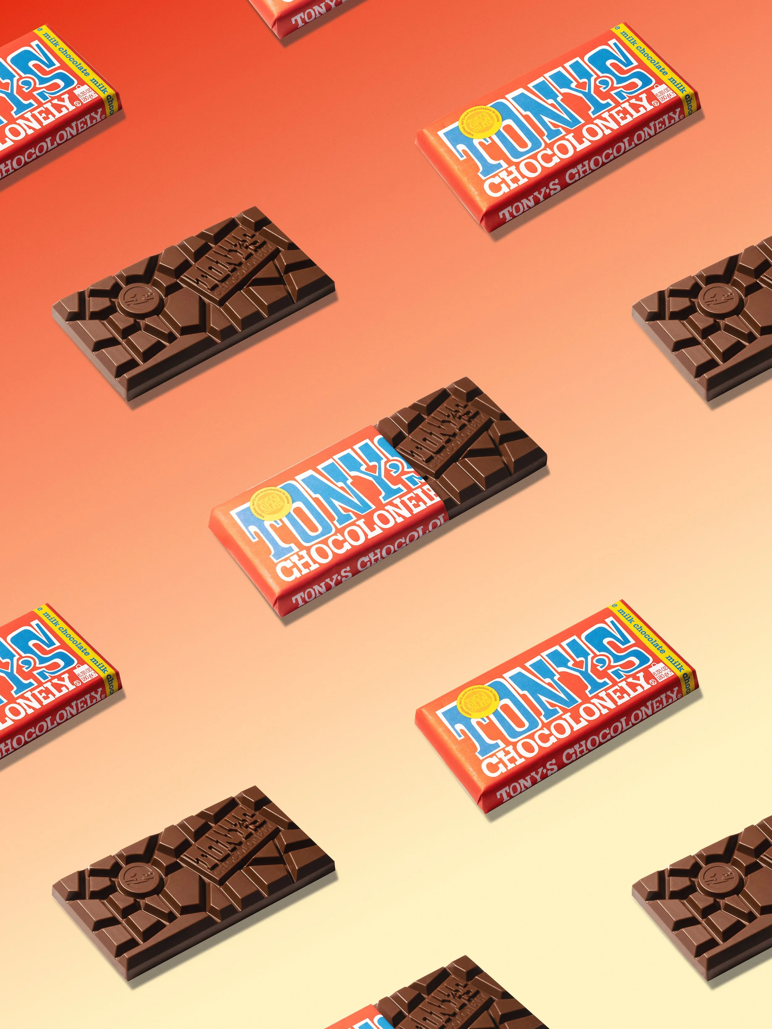 Tony's Chocolonely chocolate bars in a repeating pattern on a peach background, product photography