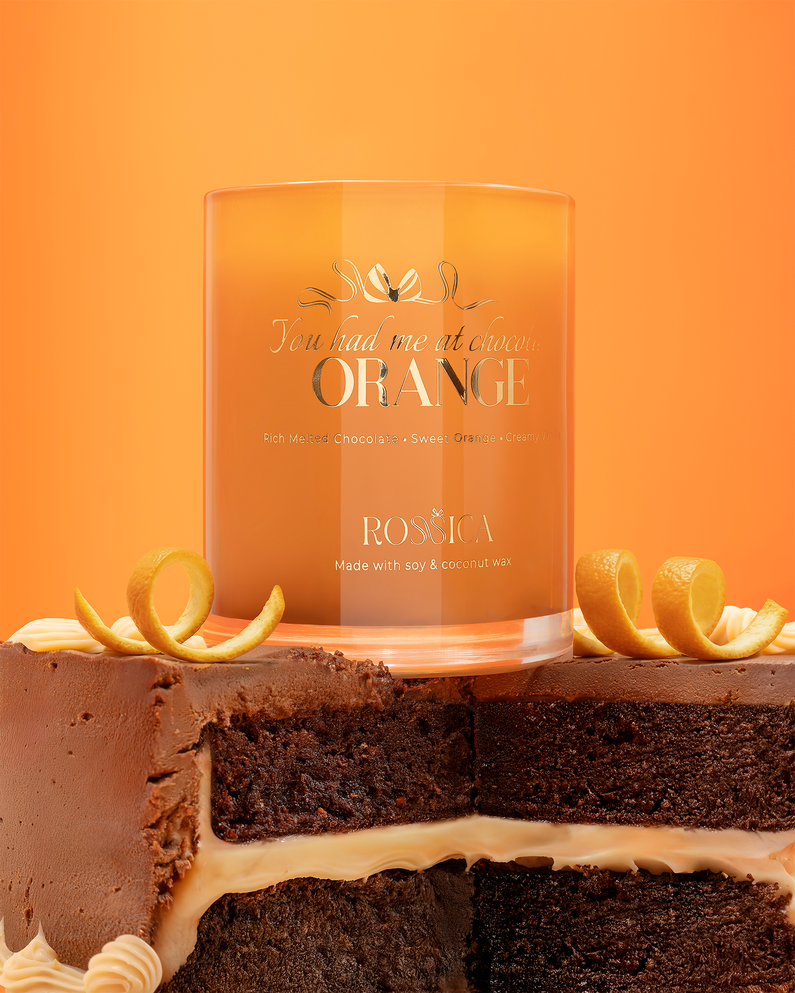 Rossica chocolate orange candle on a chocolate cake with orange slices, product photography Malta