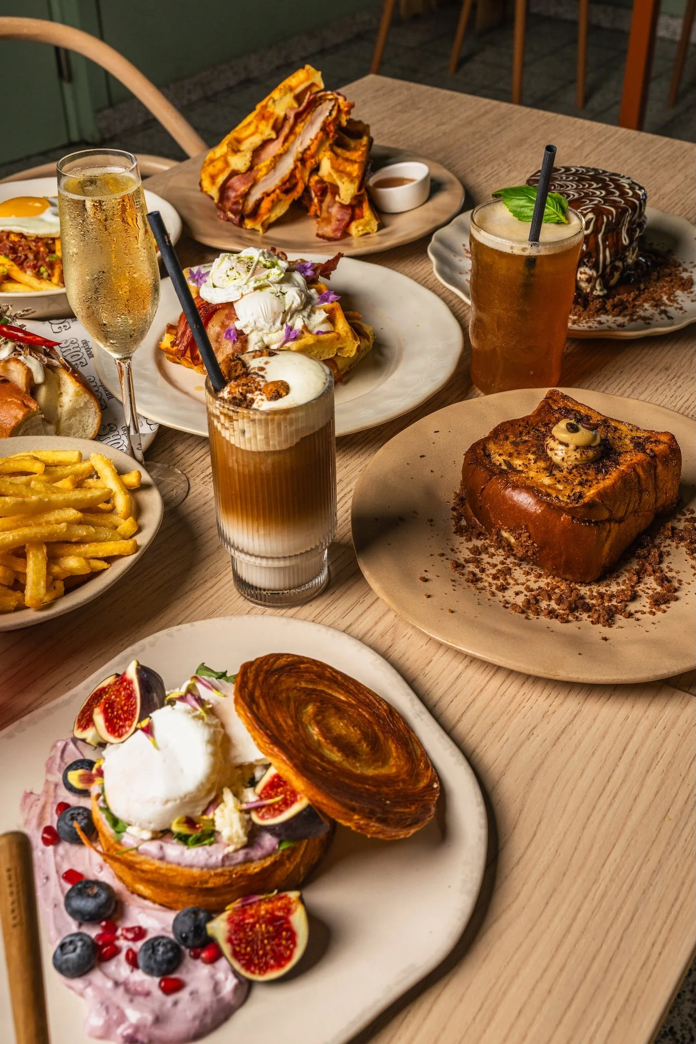 Overhead view of a brunch spread with coffees and pastries, café food photography