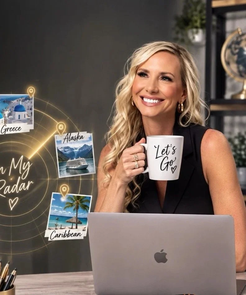 A woman with long blonde hair is smiling and holding a white mug that says "Let's Go." She is sitting at a desk with a silver MacBook in front of her. Behind her, there are photos of Greece, Alaska, and the Caribbean connected by glowing lines on a digital map, labeled "On My Radar."