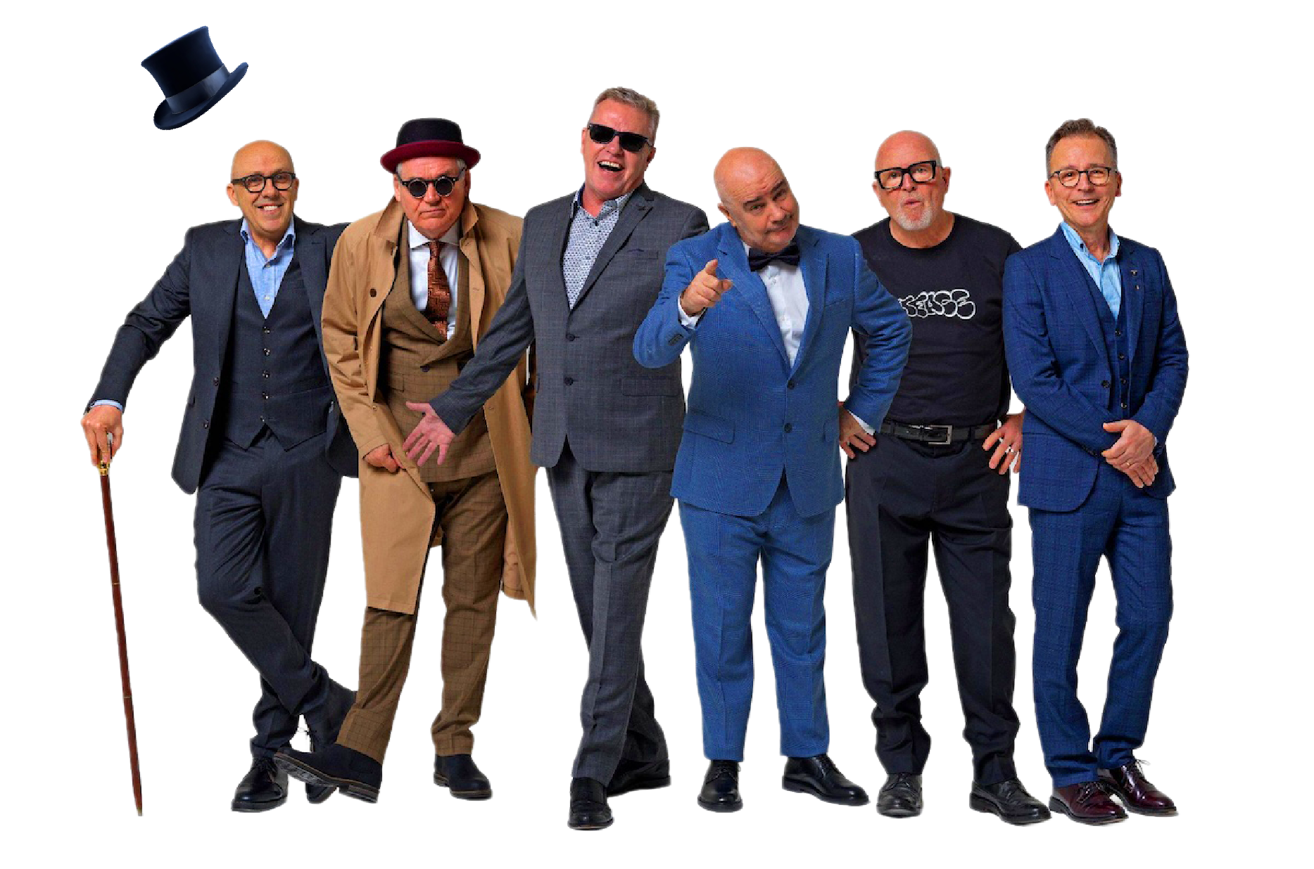 Madness in colorful suits and costumes, standing in a line and posing for the camera, with some pointing and smiling, against a plain background.