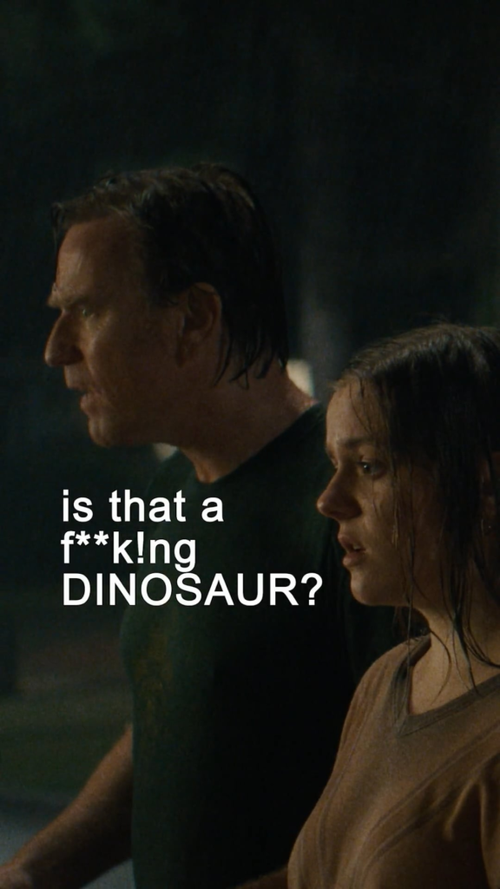 A man and a woman standing side by side outdoors at night, with the man looking serious and the woman appearing surprised or concerned. There is white text overlay that says, "is that a f**k!ng DINOSAUR?"
