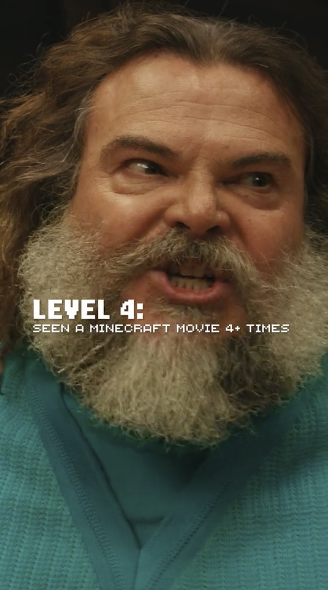 Close-up of a man with a large beard and long hair wearing a teal jacket, with white text overlay that reads 'LEVEL 4: SEEN A MINECRAFT MOVIE 4+ TIMES'.