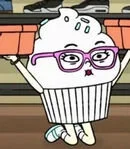 A cartoon character with purple glasses, a cupcake body, and a white whipped topping head, standing outdoors.