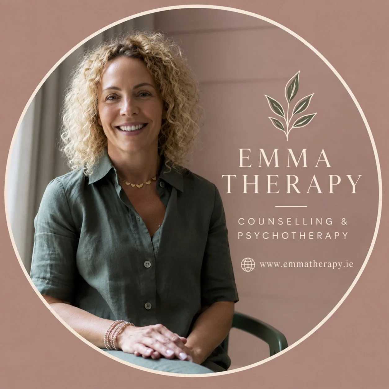 Woman with curly blonde hair smiling, wearing a green shirt, sitting in front of a brown background with the text 'Emma Therapy, Counselling & Psychotherapy' and a website link.