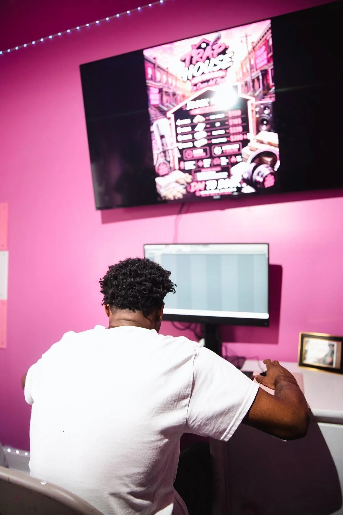 Recording session inside the pink Trap House Studios room in East Baltimore