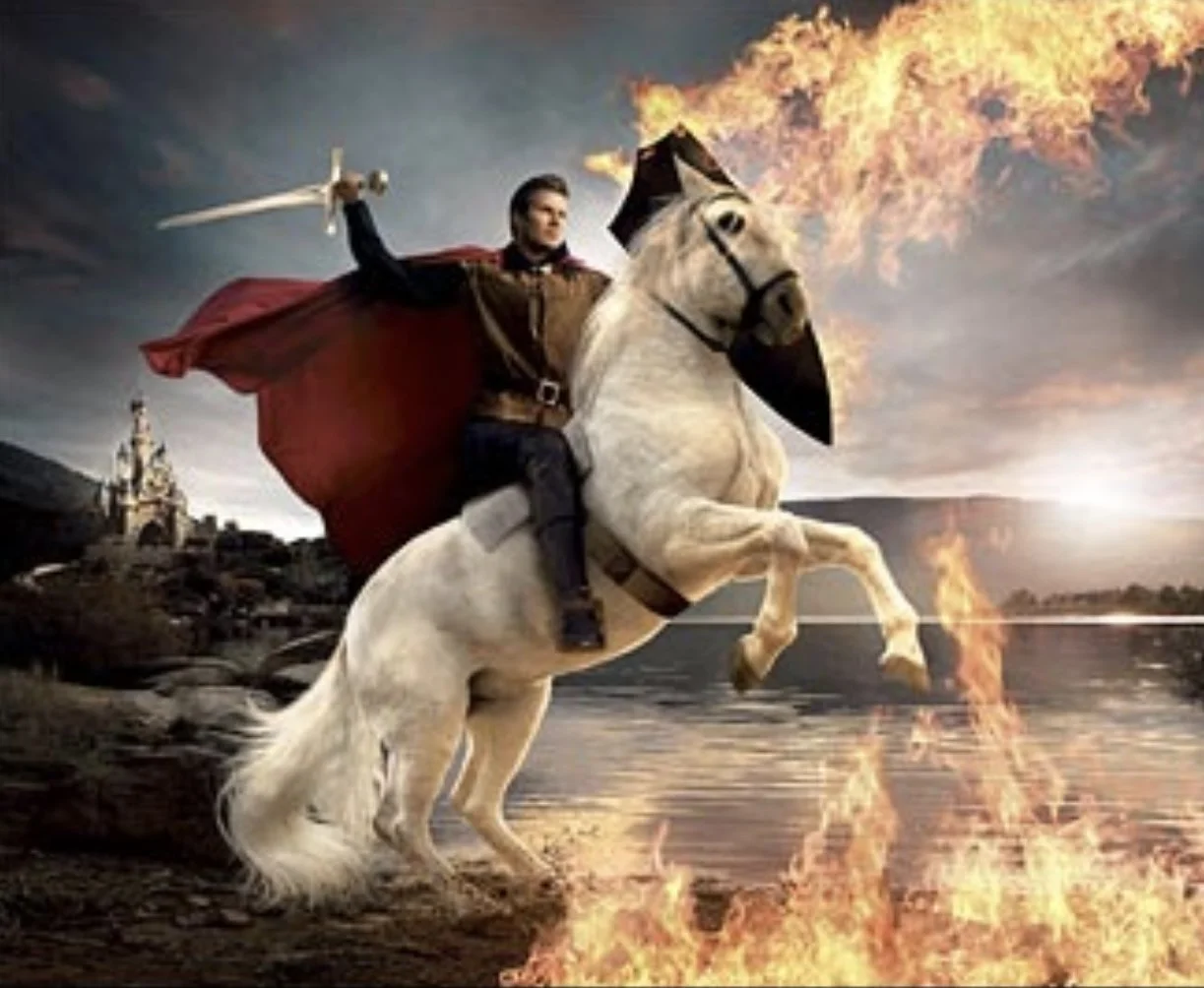 A digitally manipulated image of a man dressed as a knight riding a rearing white horse, with a fiery flaming breath coming from the horse's mouth, on a landscape with a castle in the distance and fire on the ground.