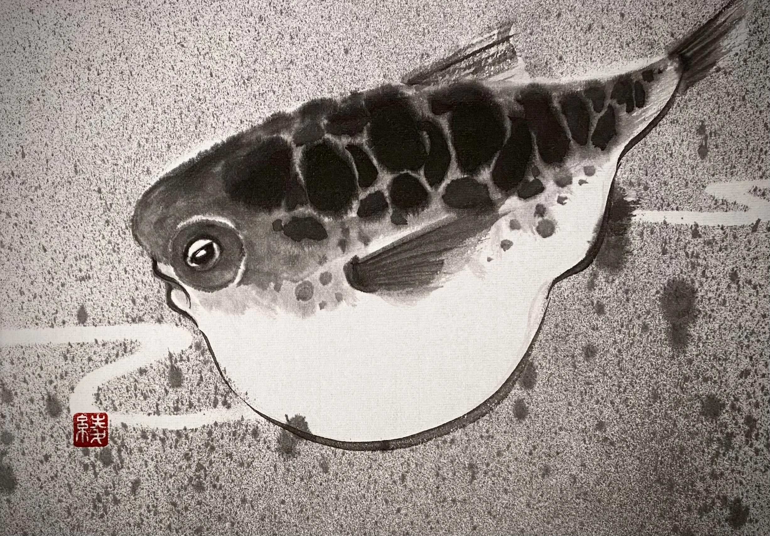 A black-and-white ink painting of a fish swimming in water, with a red seal stamp in the bottom left corner.