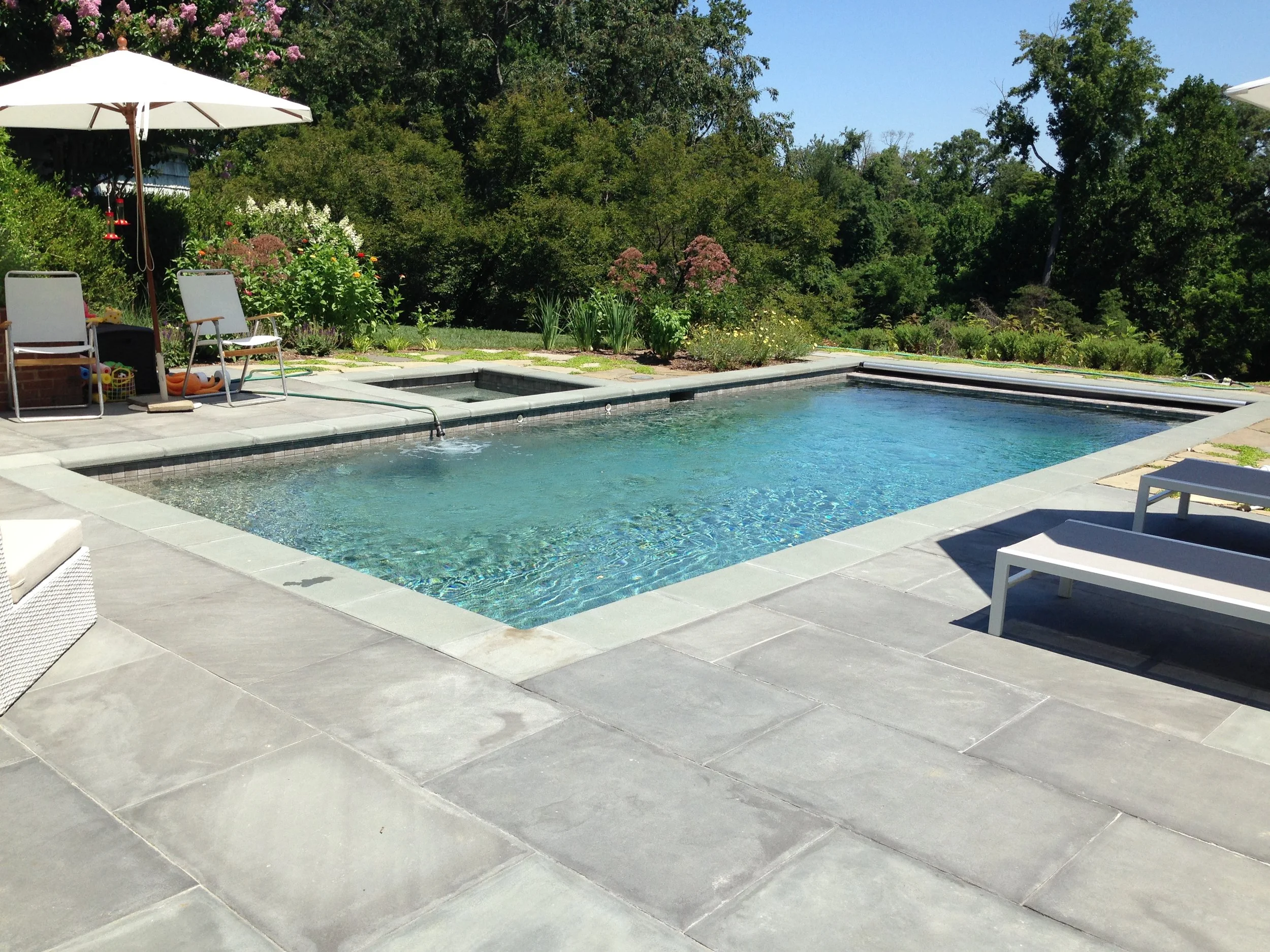 A detail of a clean lined pool and built-in spa design. Plenty of room for outdoor entertaining.