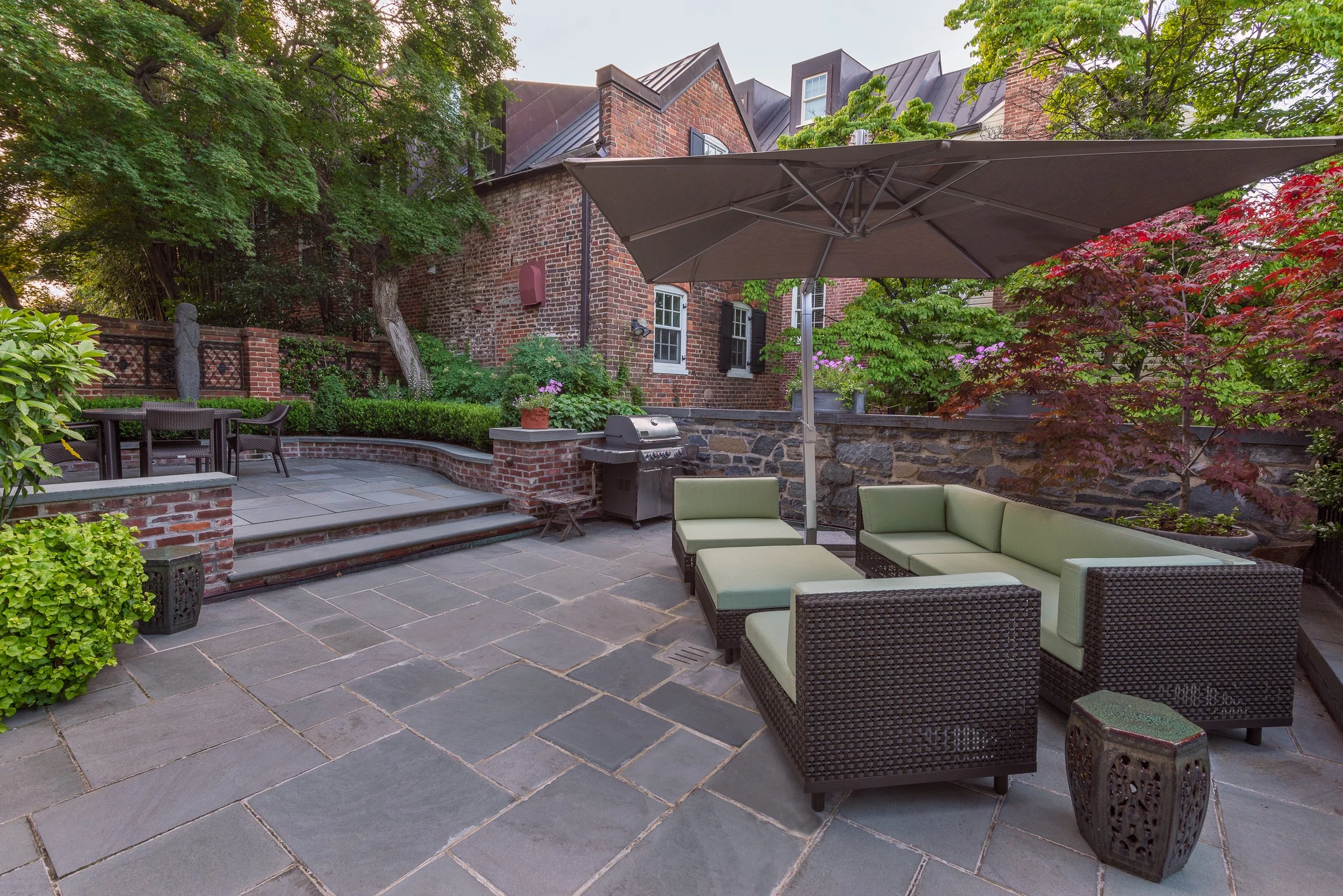 Unique rooftop patio and courtyard combines natural PA Bluestone with vintage brick walls in Georgetown, DC