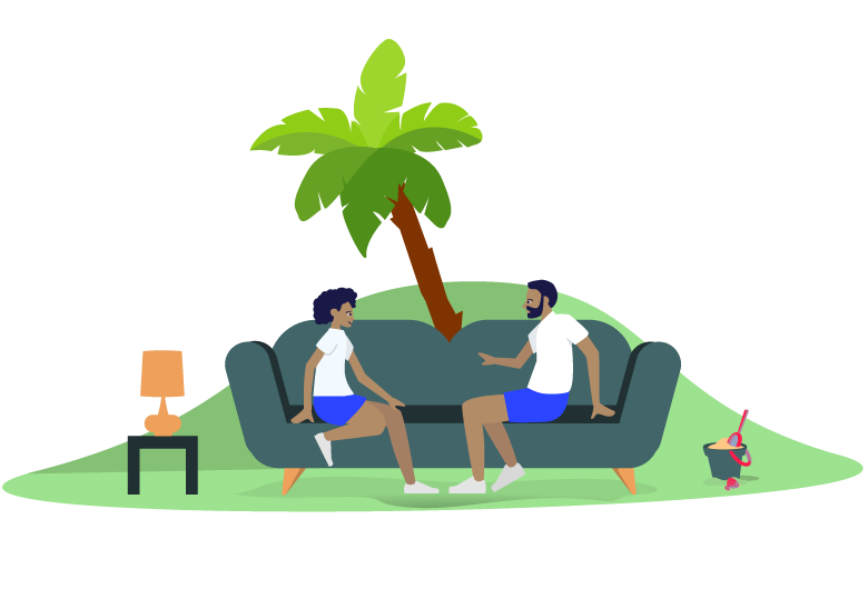Two boys sitting on a sofa outdoors, engaged in conversation, with a tree and a sandbox nearby.