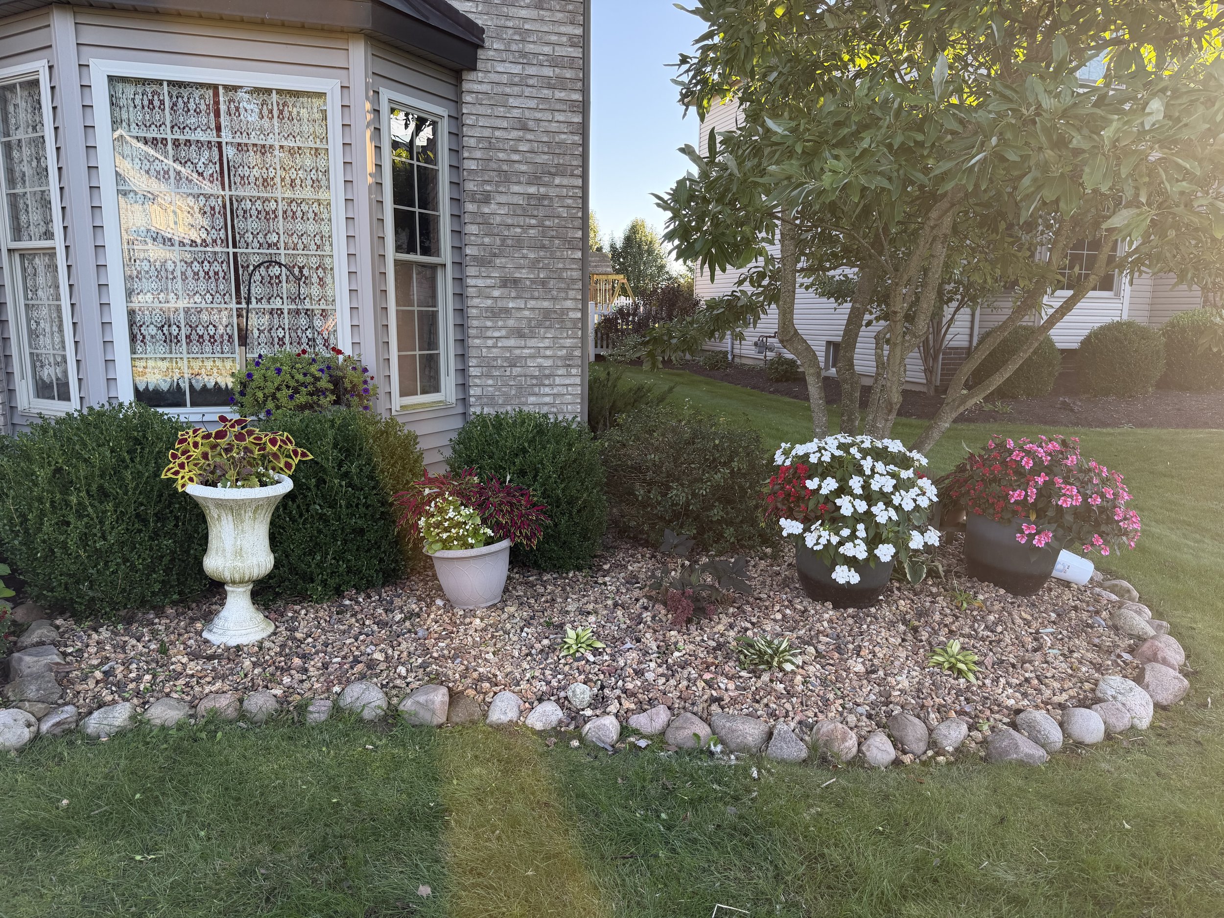 Landscaping, mulch, hedges trimmed, edging,