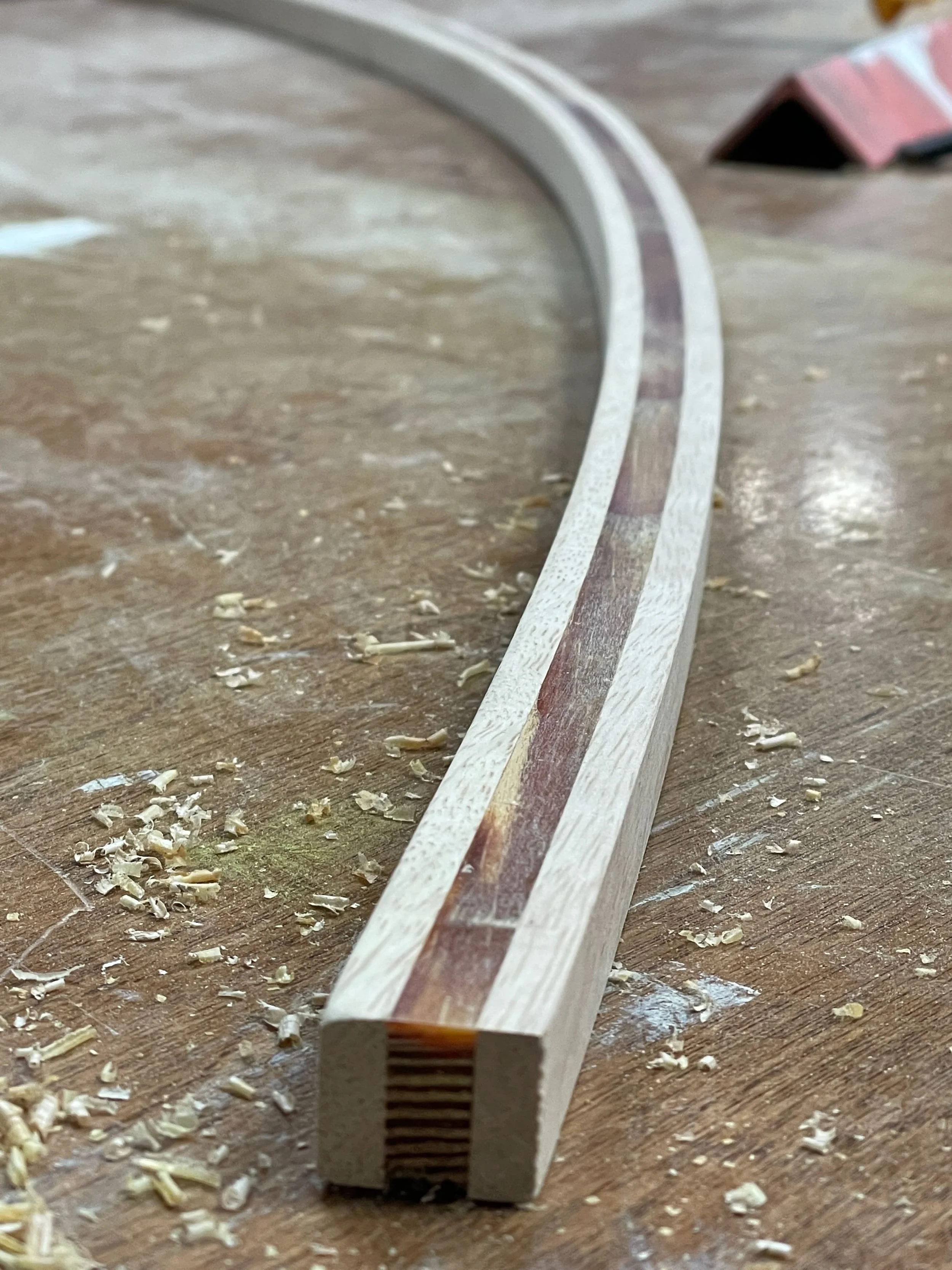 the curve, signifying a rainbow and hope, created without heat, using only glue to hold the shape